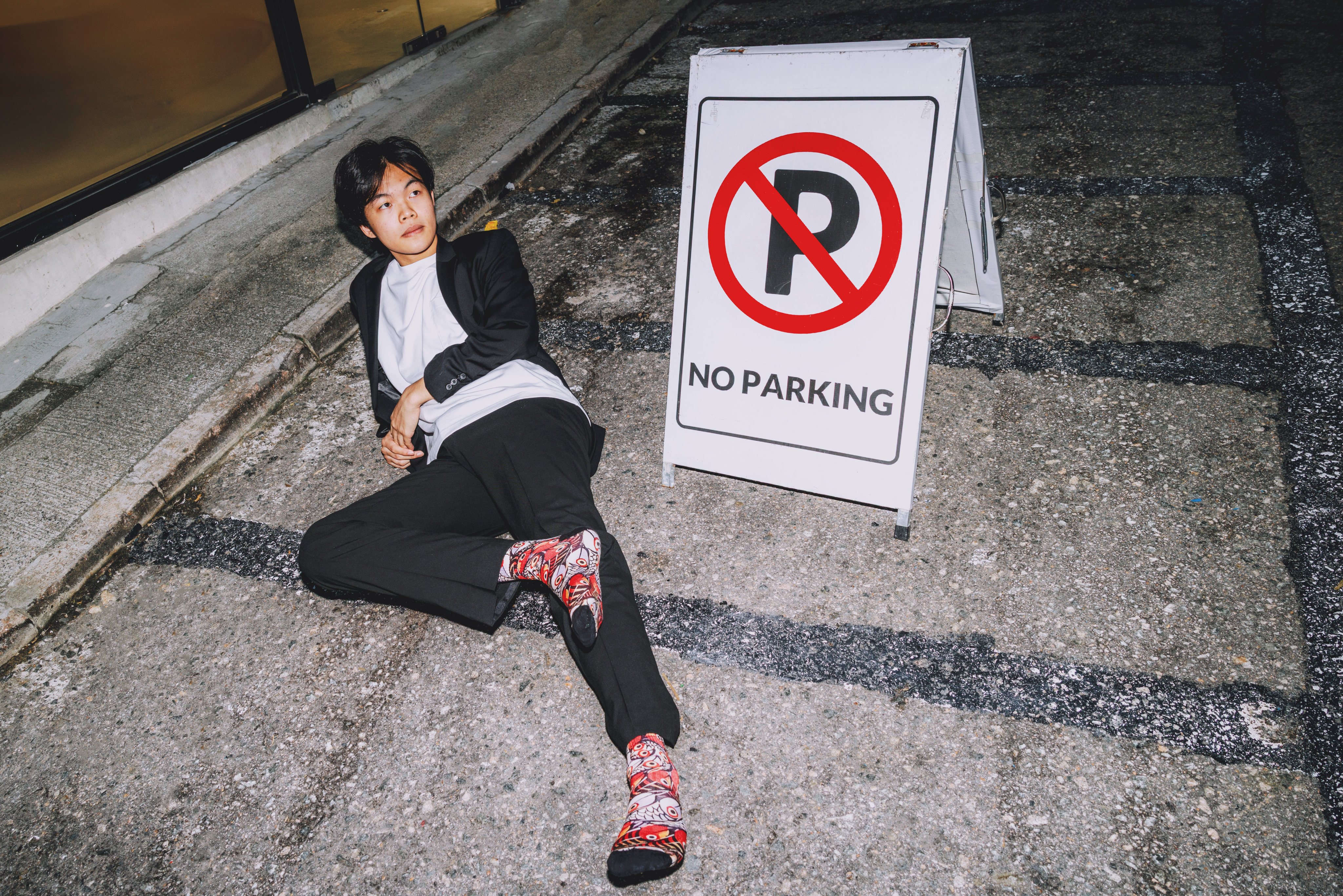 Founder of Sababu Socks, Darren Lee, sports a pair of Fishy on Me socks, designed by Tanzanian artist Chinga. Photo: Jocelyn Tam