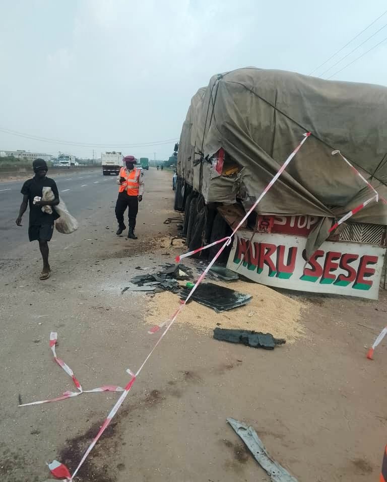 People walk past the scene of a crash involving British boxer Anthony Joshua in Lagos, Nigeria on Monday. Photo: Federal Road Safety Corps via AP