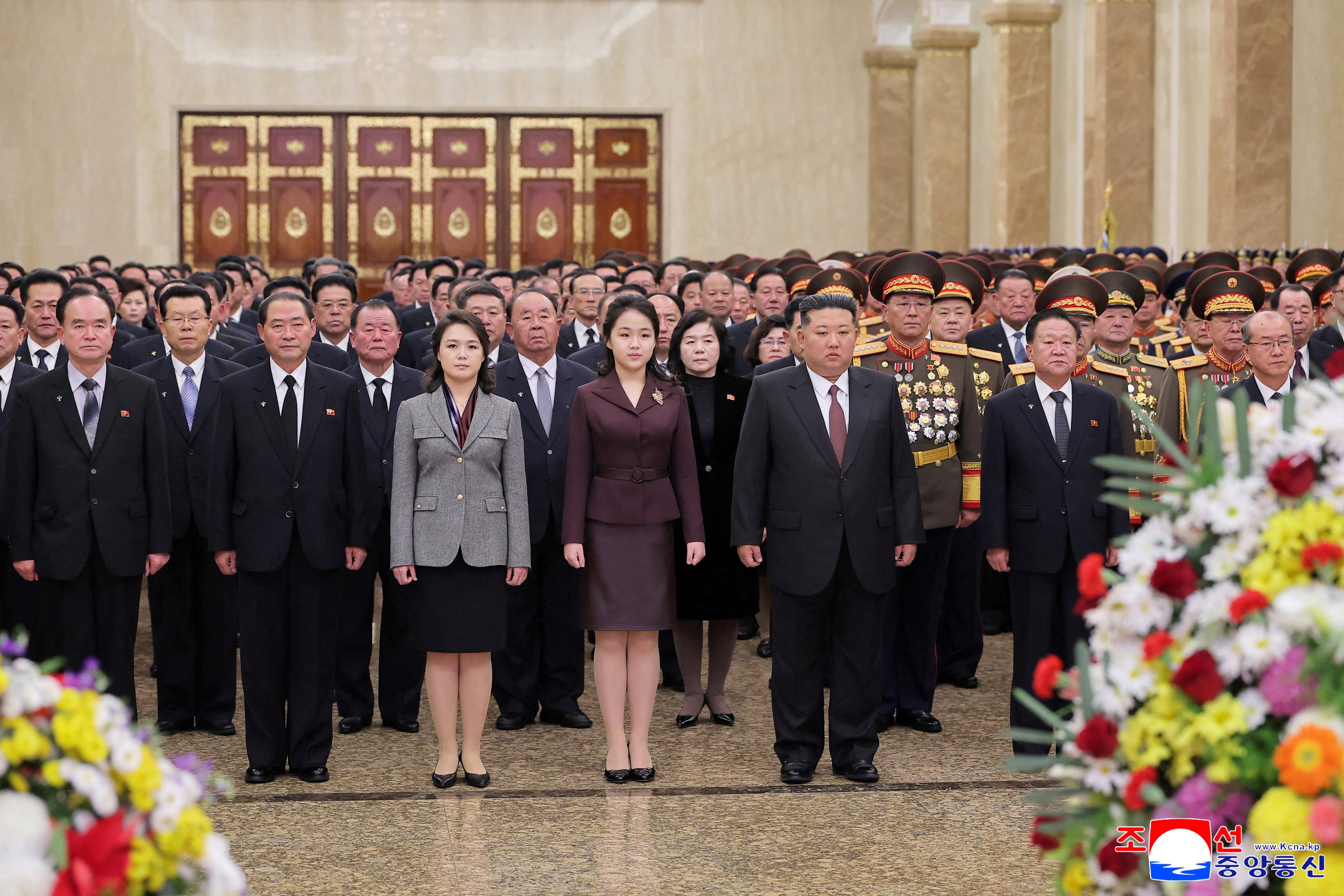 North Korean leader Kim Jong-un, his wife and their daughter (centre) visit the Kumsusan Palace of the Sun in Pyongyang on Thursday. Photo: KCNA via Reuters