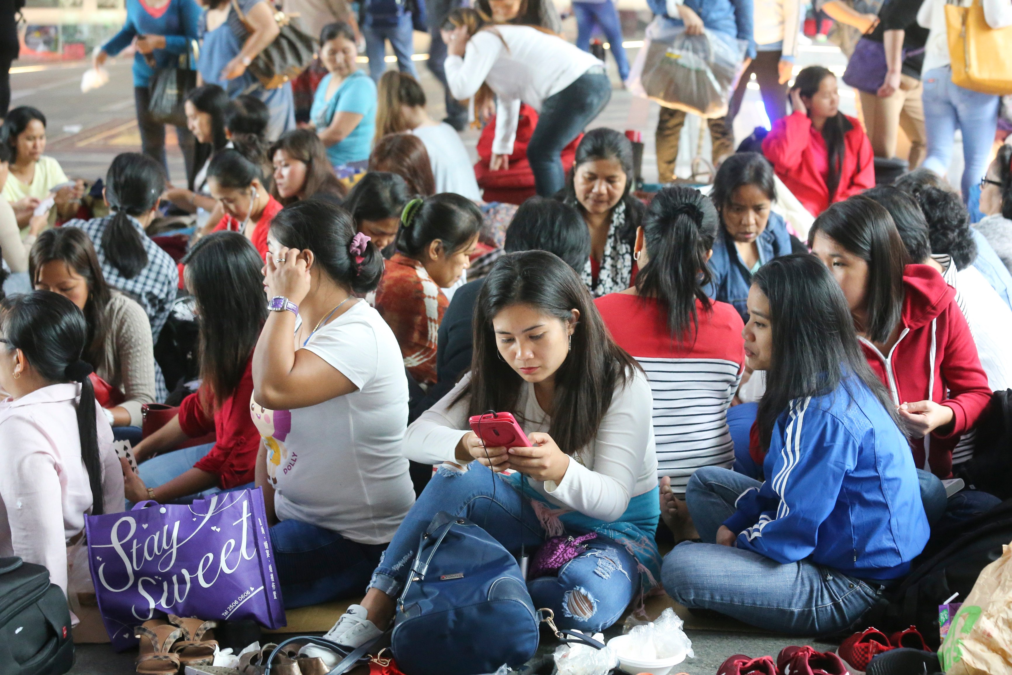 Filipino domestic workers gather on a street in Hong Kong. Indonesia and the Philippines have provided millions of helpers to the rest of Asia over the decades. Photo: Dickson Lee