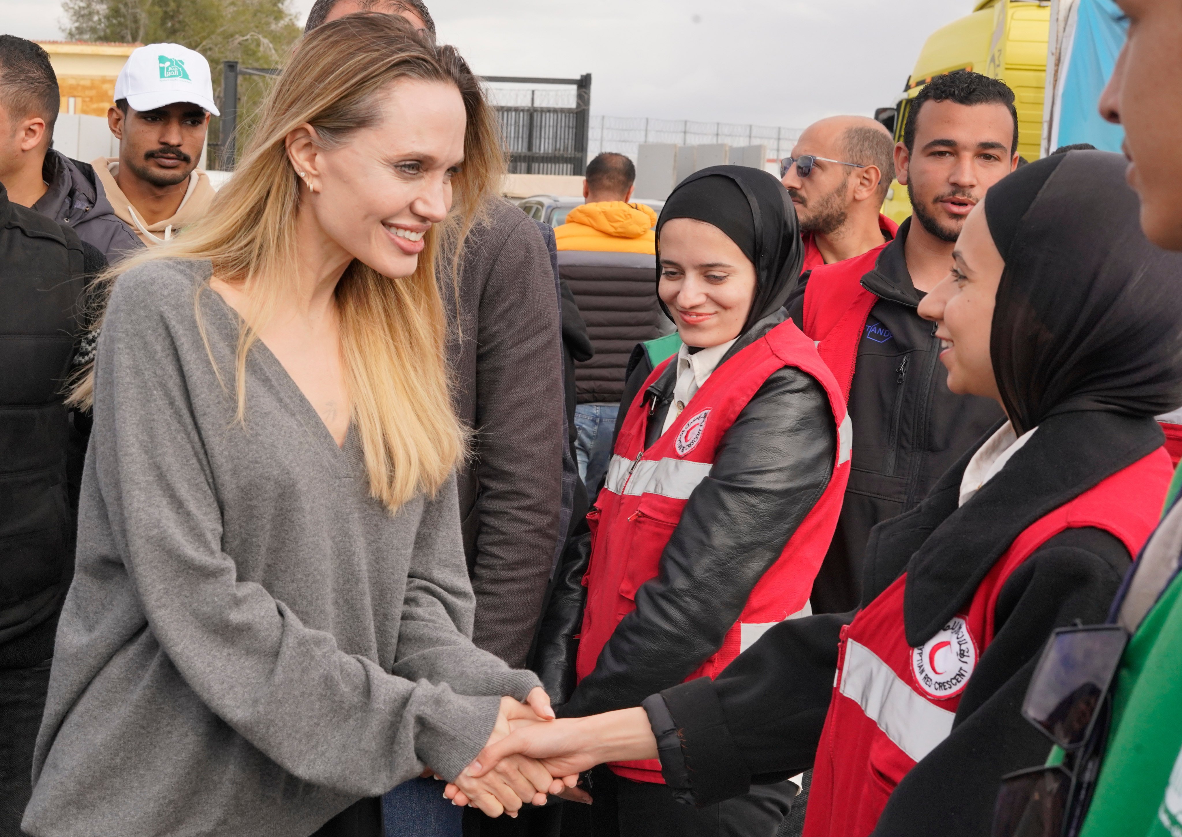 American actress and film producer Angelina Jolie greets Red Crecent workers during her visit to the Rafah border crossing between Egypt and Gaza on Friday. Photo: AP