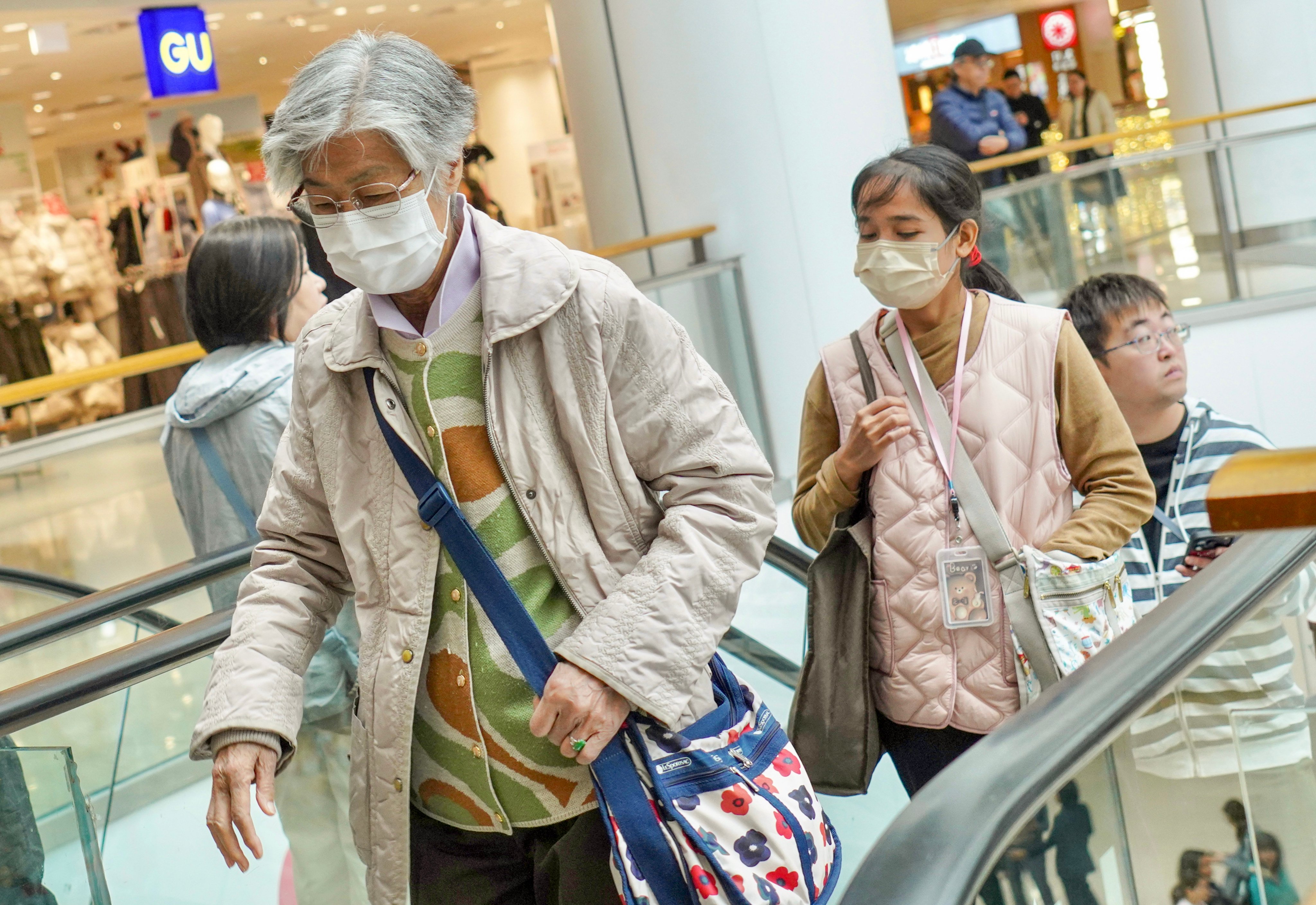 People wear masks inside a shopping centre in Tai Kok Tsui. Photo: Karma Lo