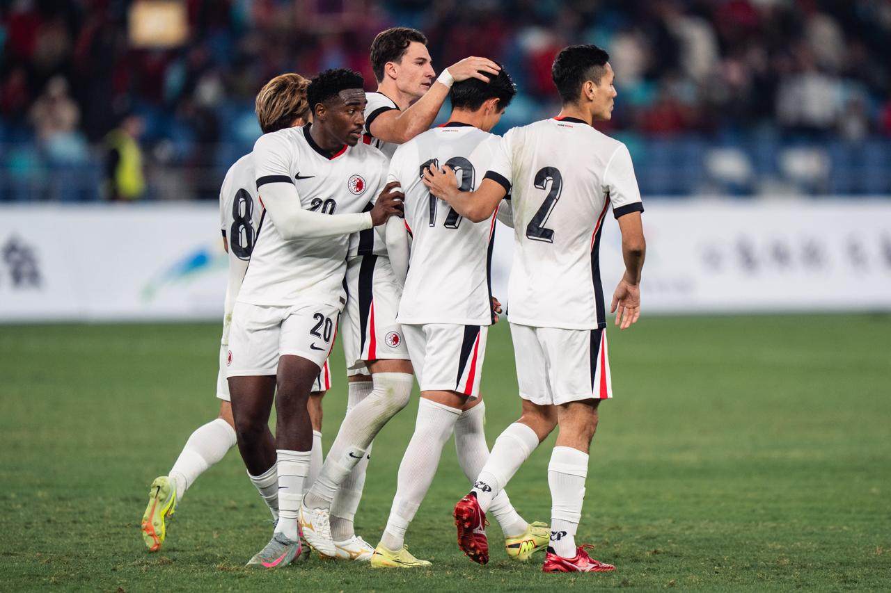 Hong Kong’s Vas Nunez gives Wong Wai a consoling pat on the head after his missed penalty handed Guangdong victory. Photo: HKFA