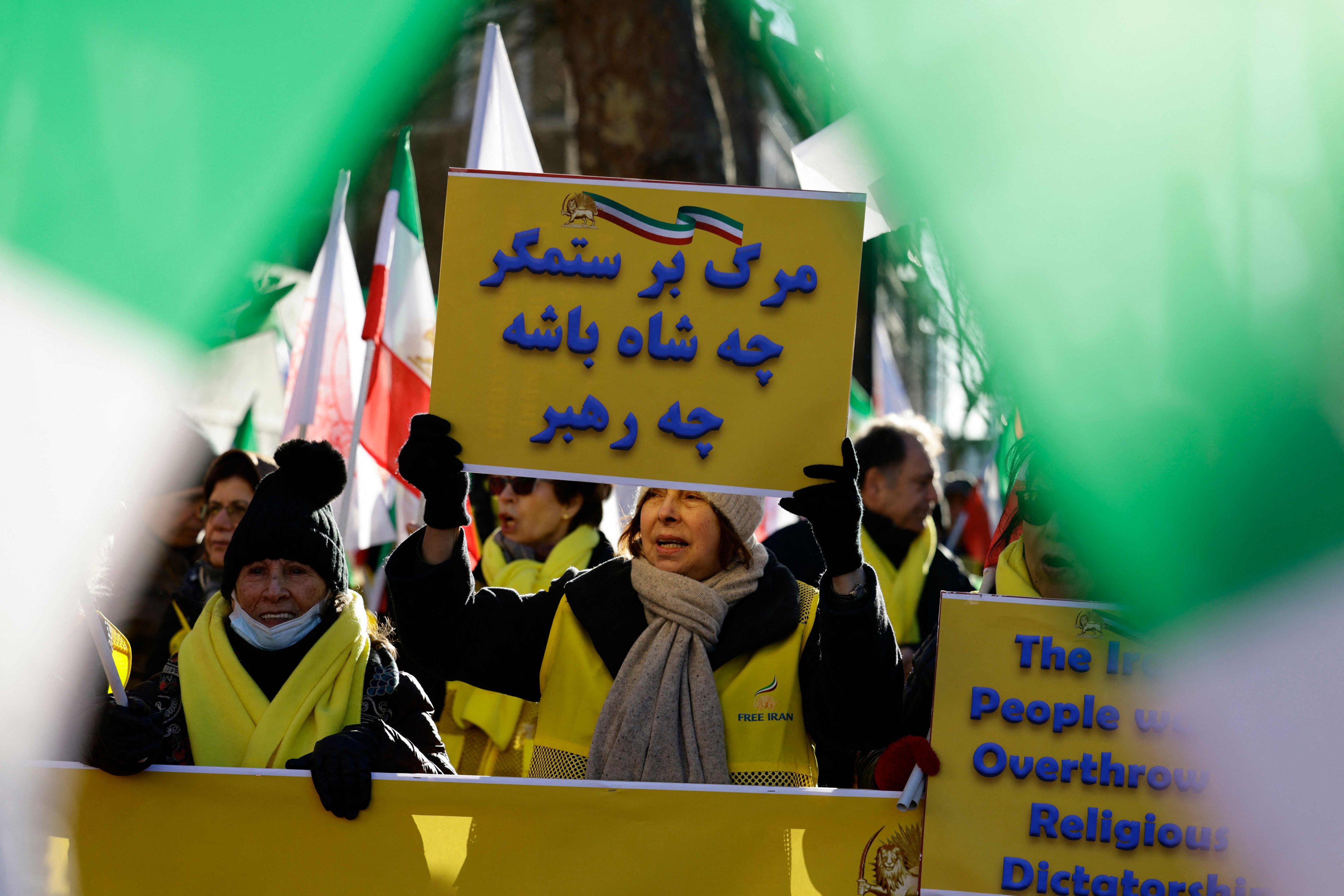 Protesters gather with placards outside the gates of Downing Street to attend a London rally in solidarity with Iran’s uprising, organised by The Association of Anglo-Iranian Women in the UK, in central London on Saturday. Photo: AFP