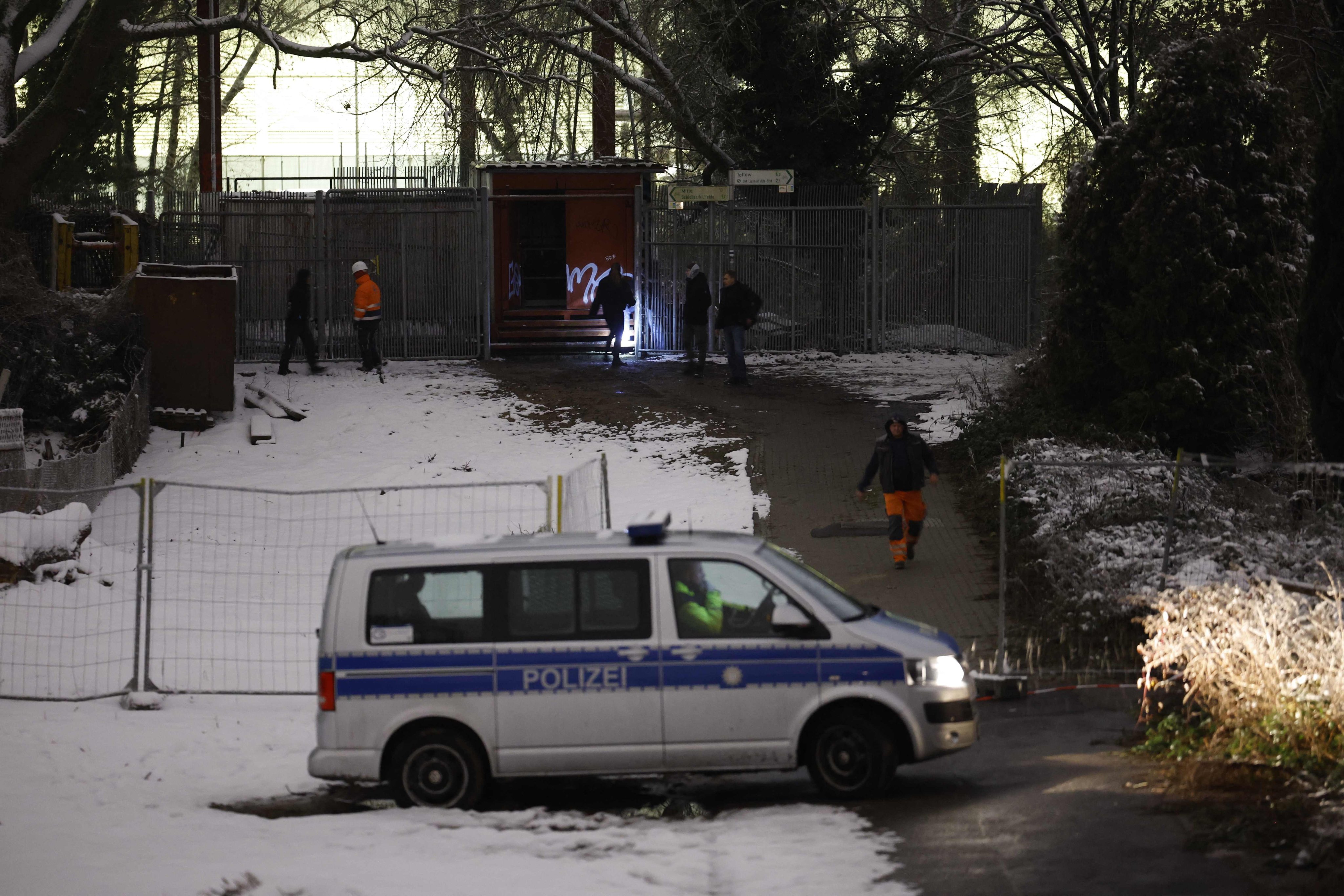 Police emergency staff at the site of a cable bridge fire in front of the Lichterfelde power plant on the Teltow Canal in Berlin, Germany on Saturday. Photo: AFP