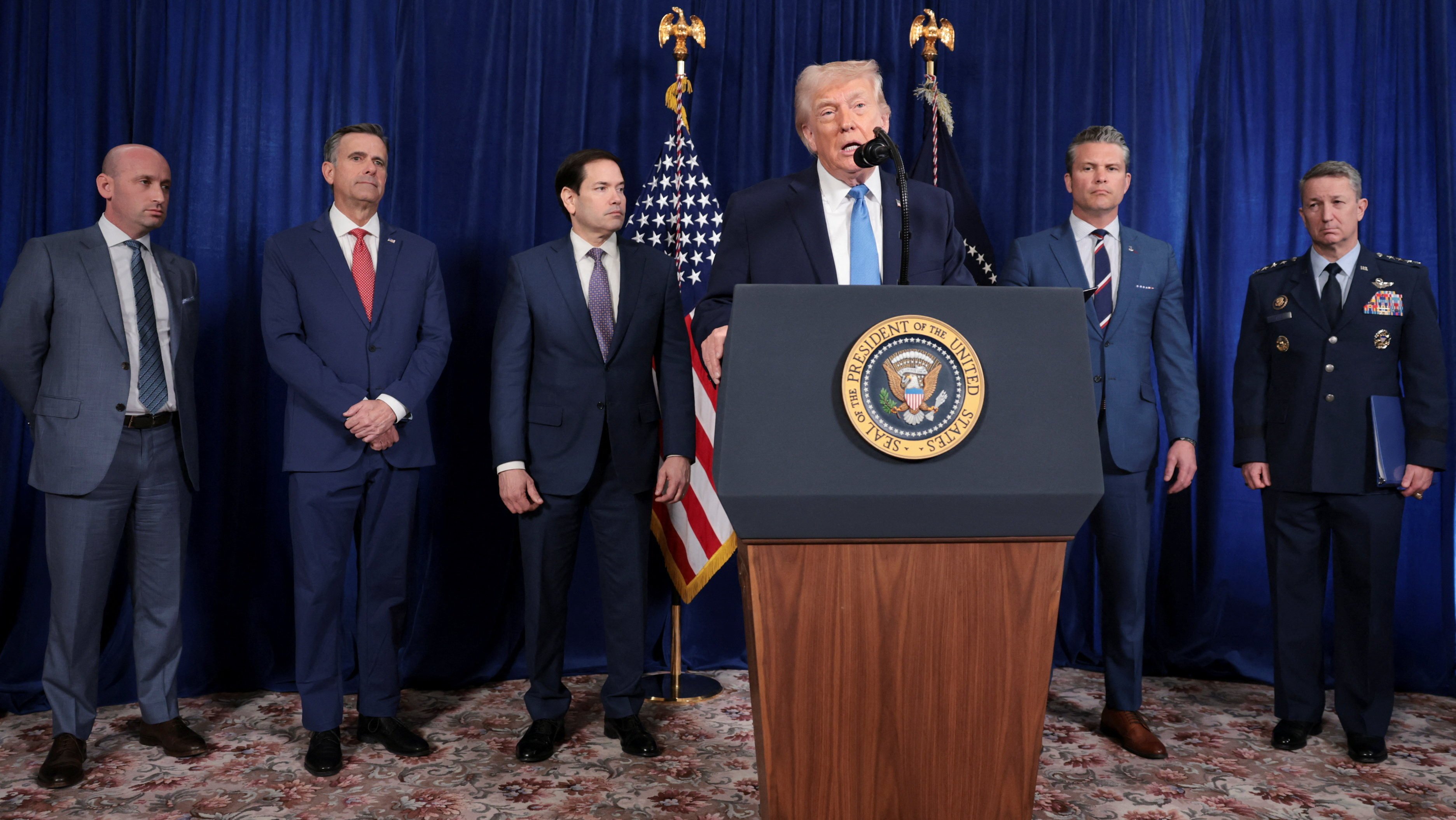 US President Donald Trump, flanked by his top officials, addresses a press conference following the capture of the Venezuelan first couple, in Florida on January 3. Photo: Reuters