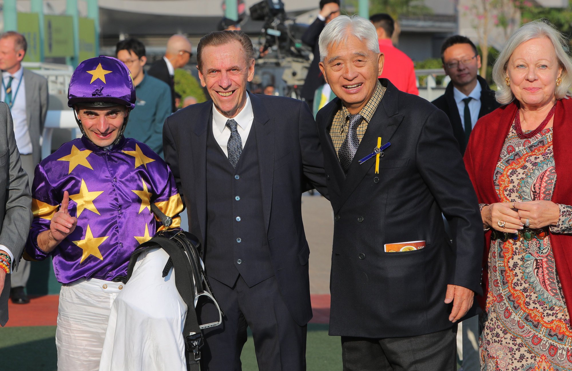 Jockey Andrea Atzeni, trainer John Size (second left) and connections of Stellar Express celebrate victory.