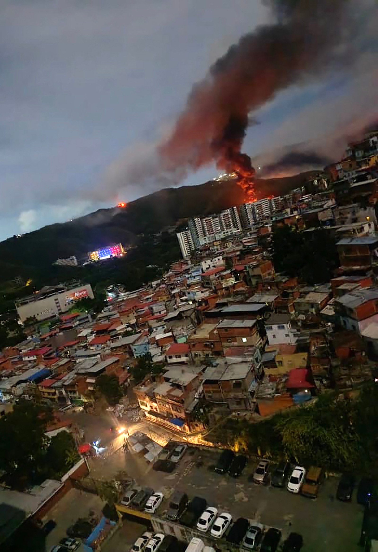 Fire rises from a Venezuelan military complex in Caracas on January 3, after US forces captured the country’s leader, Nicolas Maduro. Photo: AFP