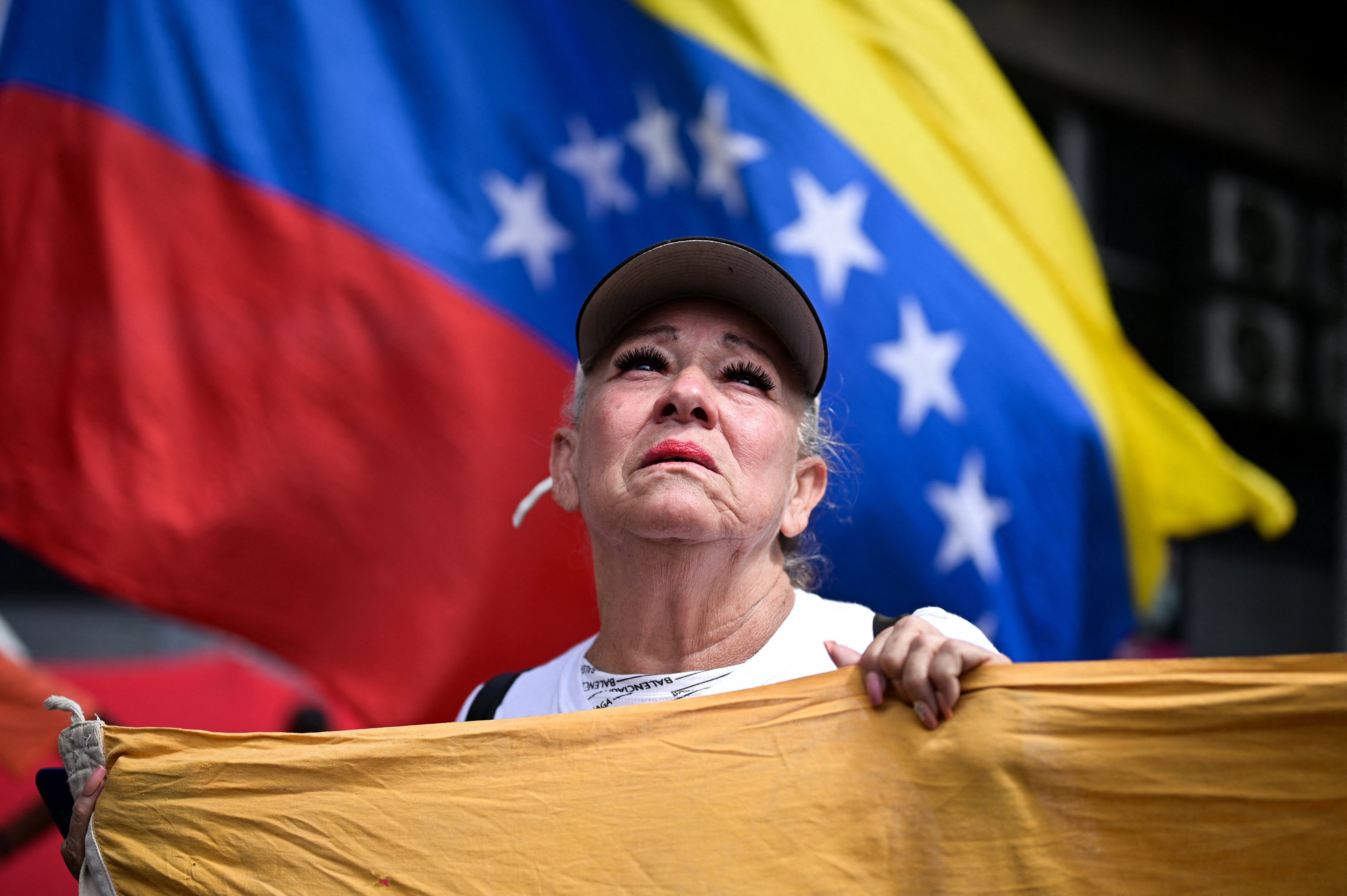 A woman reacts as government supporters gather, after US President Donald Trump said the US had struck Venezuela and captured its President Nicolas Maduro, in Caracas, Venezuela, on January 3. Photo: Reuters