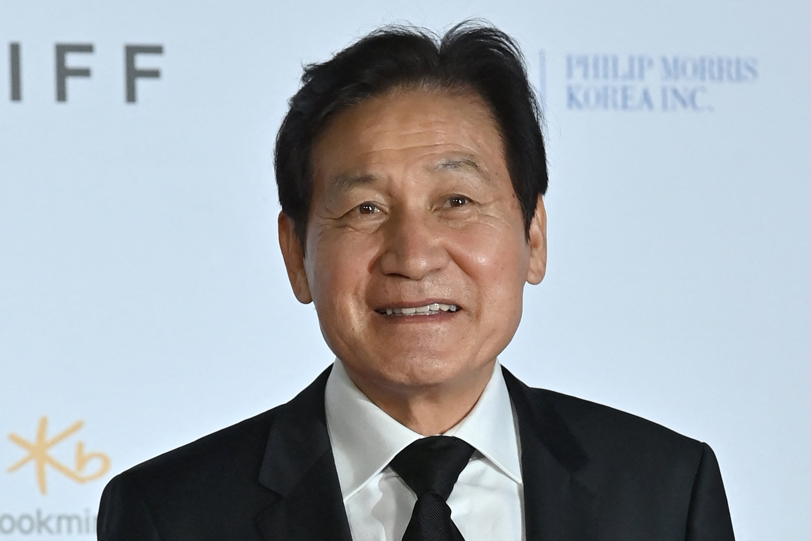 Ahn Sung-ki poses on the red carpet during the opening ceremony of the 26th Busan International Film Festival in 2021. Photo: AFP