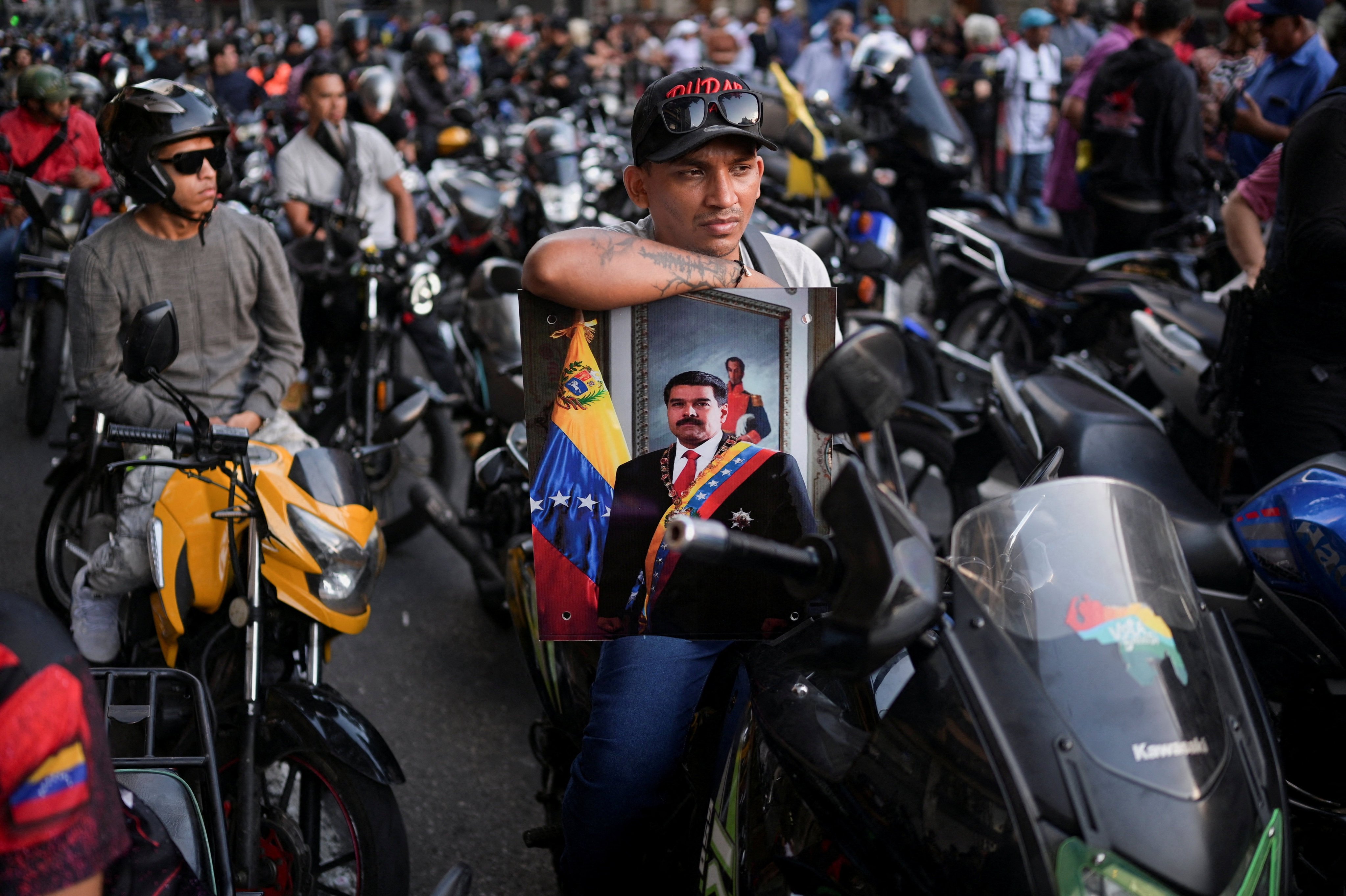 Members of the militia group known as ‘Colectivos’ take part in a march in Caracas, Venezuela, calling for the release of President Nicolas Maduro and his wife. Photo: Reuters