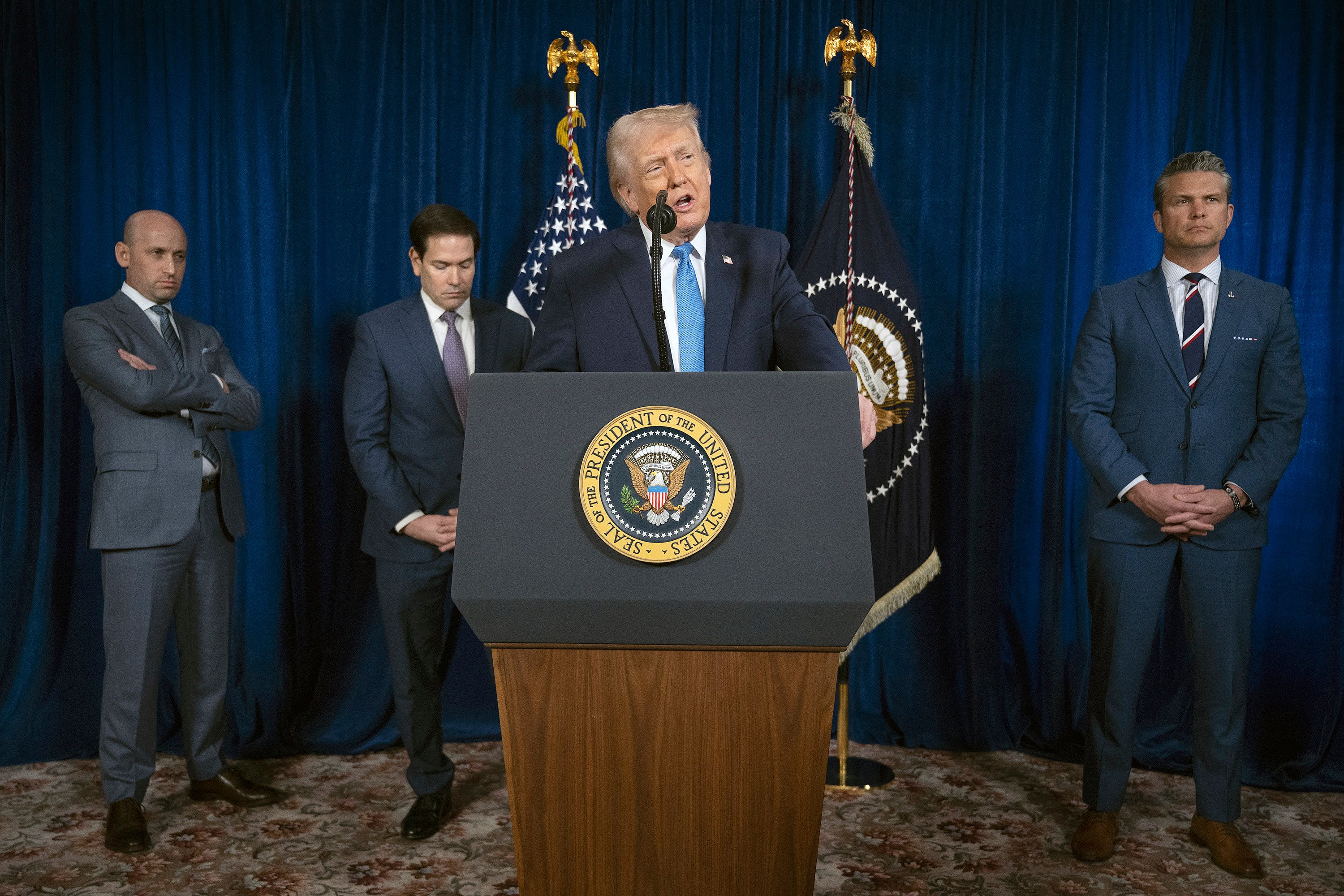 US President Donald Trump, flanked by senior members of his administration, speaks to the press following American military strikes on Caracas, Venezuela. Photo: TNS