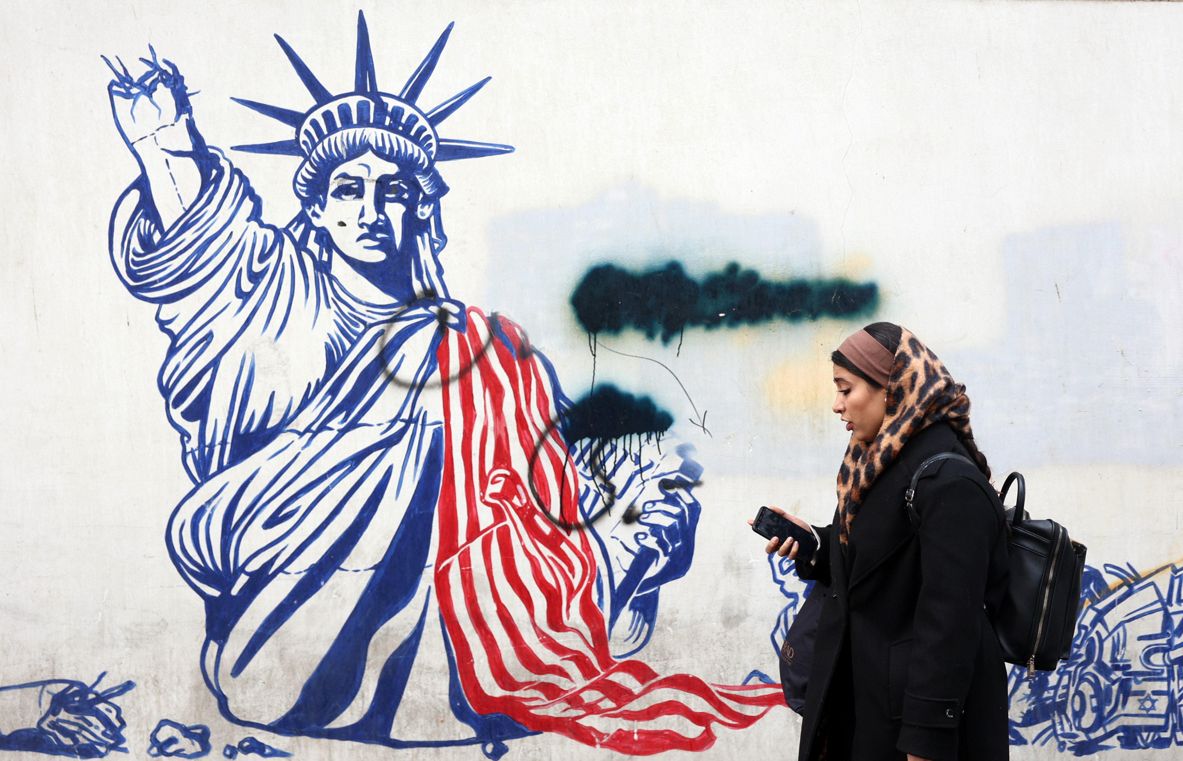 An anti-US mural on a street in Tehran, pictured on January 3. US President Donald Trump has previously threatened the Iranian leadership directly. Photo: EPA