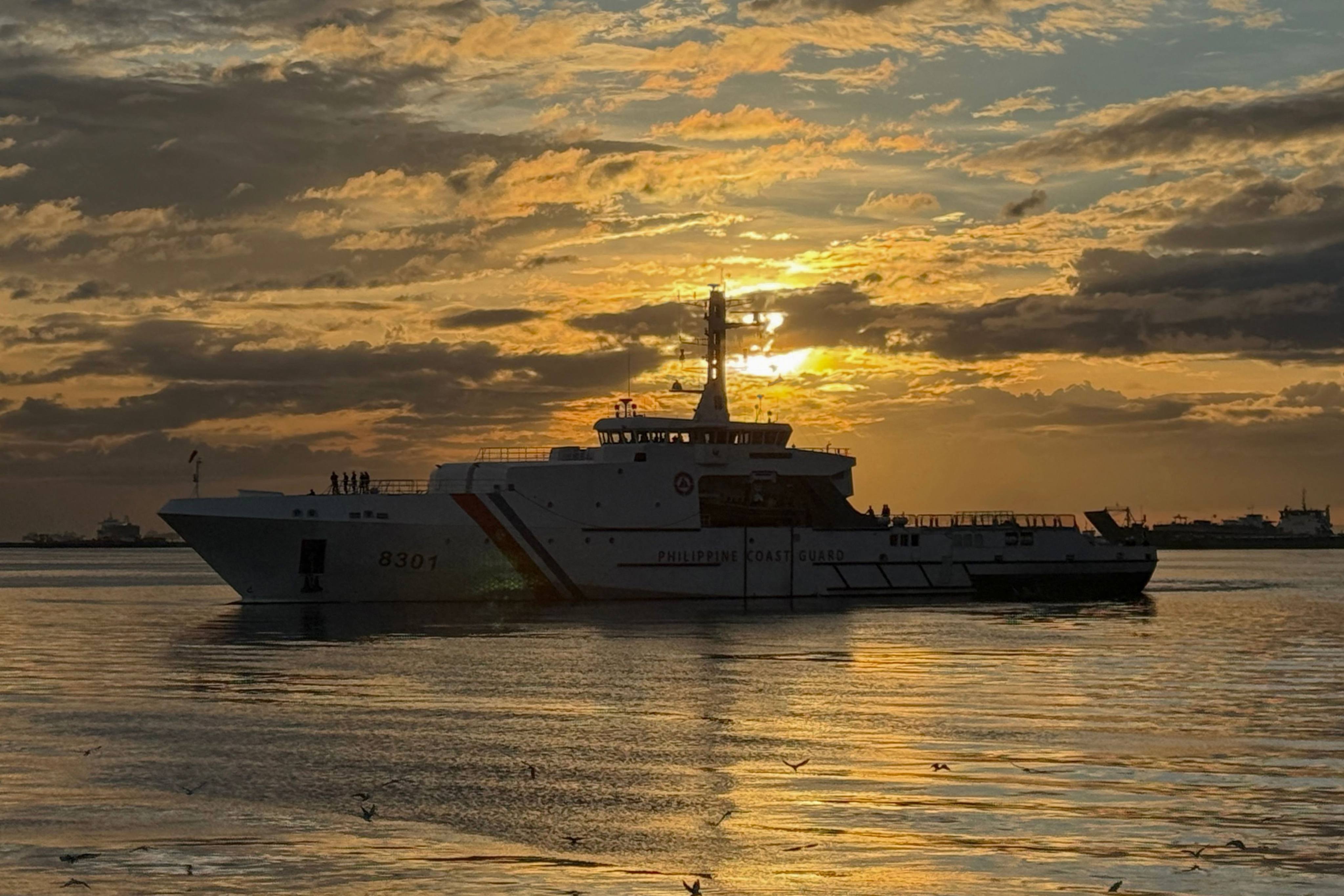 A Philippine Coast Guard patrol vessel sails along Manila Bay on December 16, 2025. Photo: AFP