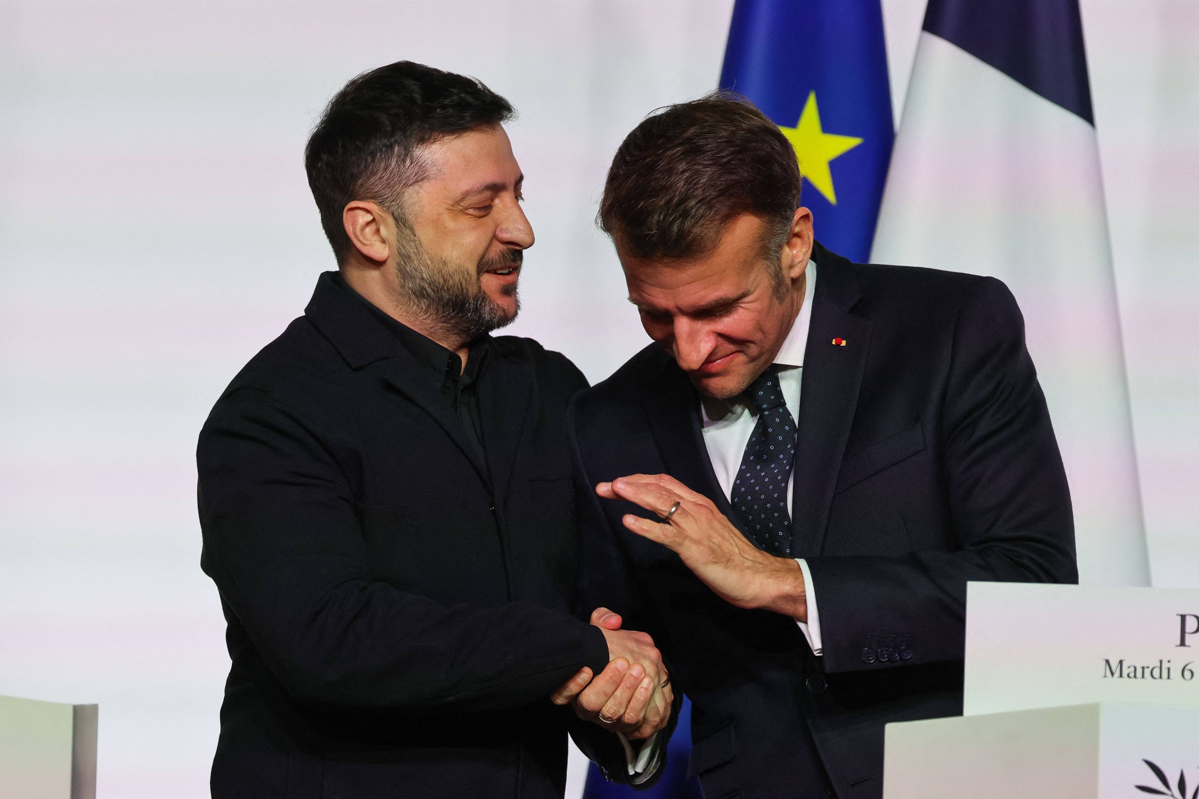 Ukraine’s President Volodymyr Zelensky (left) shakes hands with France’s President Emmanuel Macron at the Elysee Palace in Paris on Tuesday. Photo: AFP