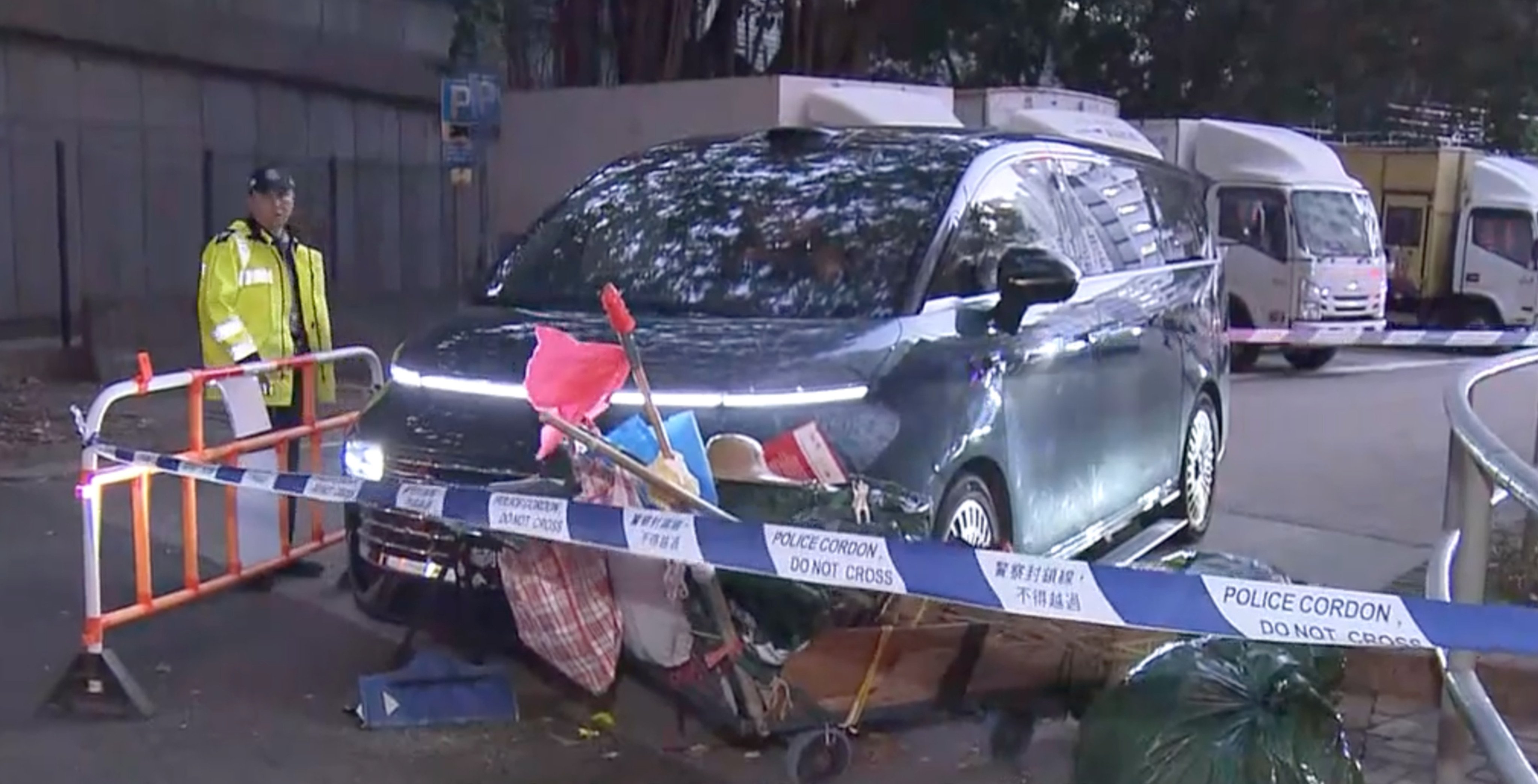 A 74-year-old cleaner was struck by a left-hand drive Geely car operating on a trade licence plate at a Hong Kong public housing estate on Wednesday. Photo: Now TV