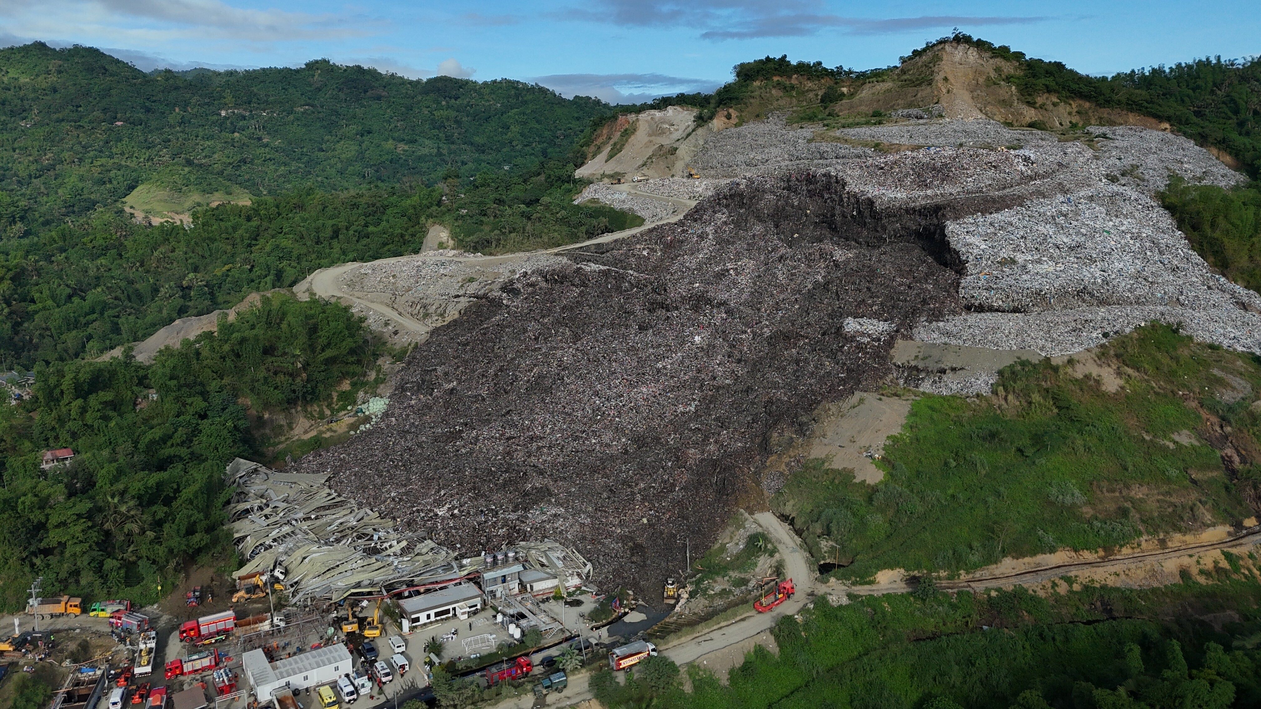 A huge mound of garbage collapsed at a waste segregation facility in Cebu City on Friday. Photo: AP