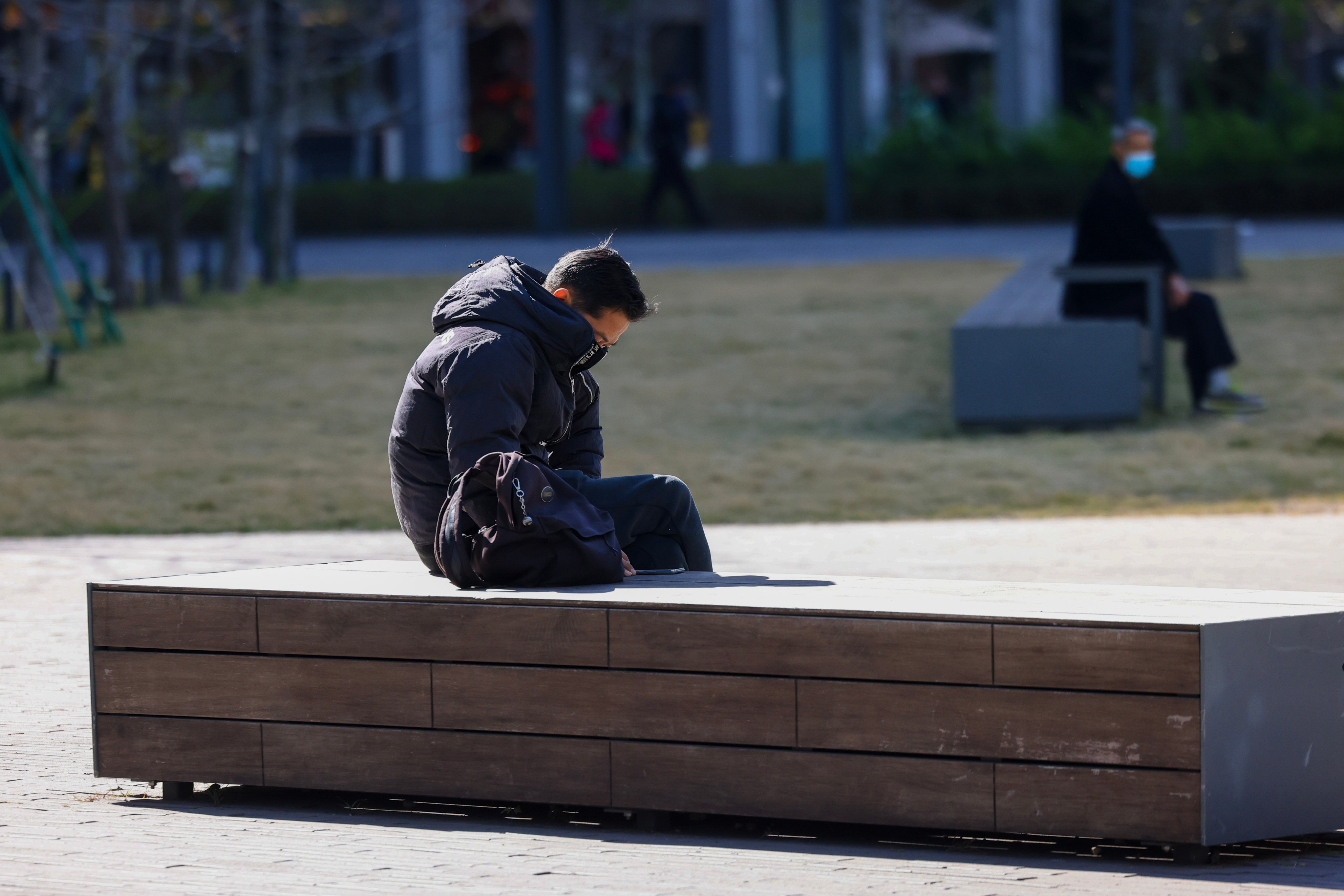 A man sits outside on a cold day in Hong Kong. SAD, or seasonal affective disorder, is triggered by extreme weather changes and less daylight in winter, making us feel, well, sad. Photo: Dickson Lee