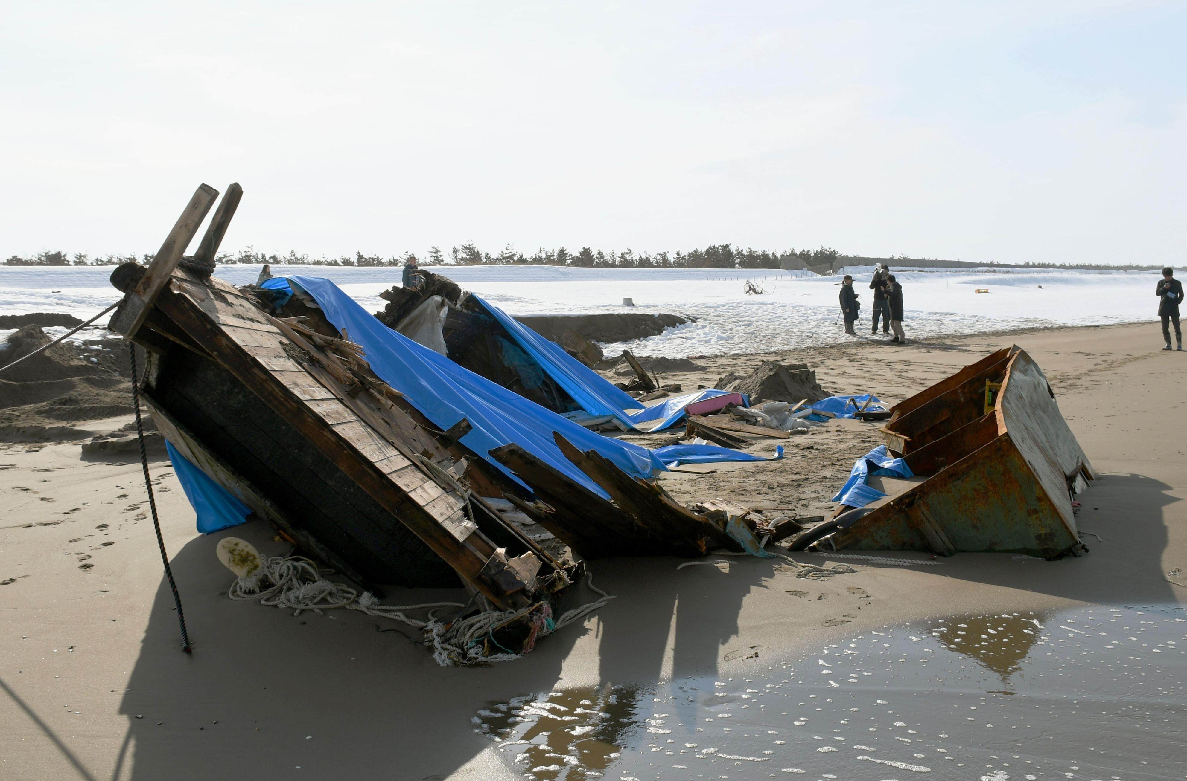 A wooden boat that washed ashore on a beach in Kanazawa, Japan, in 2018. Seven bodies were found nearby. Photo: Kyodo