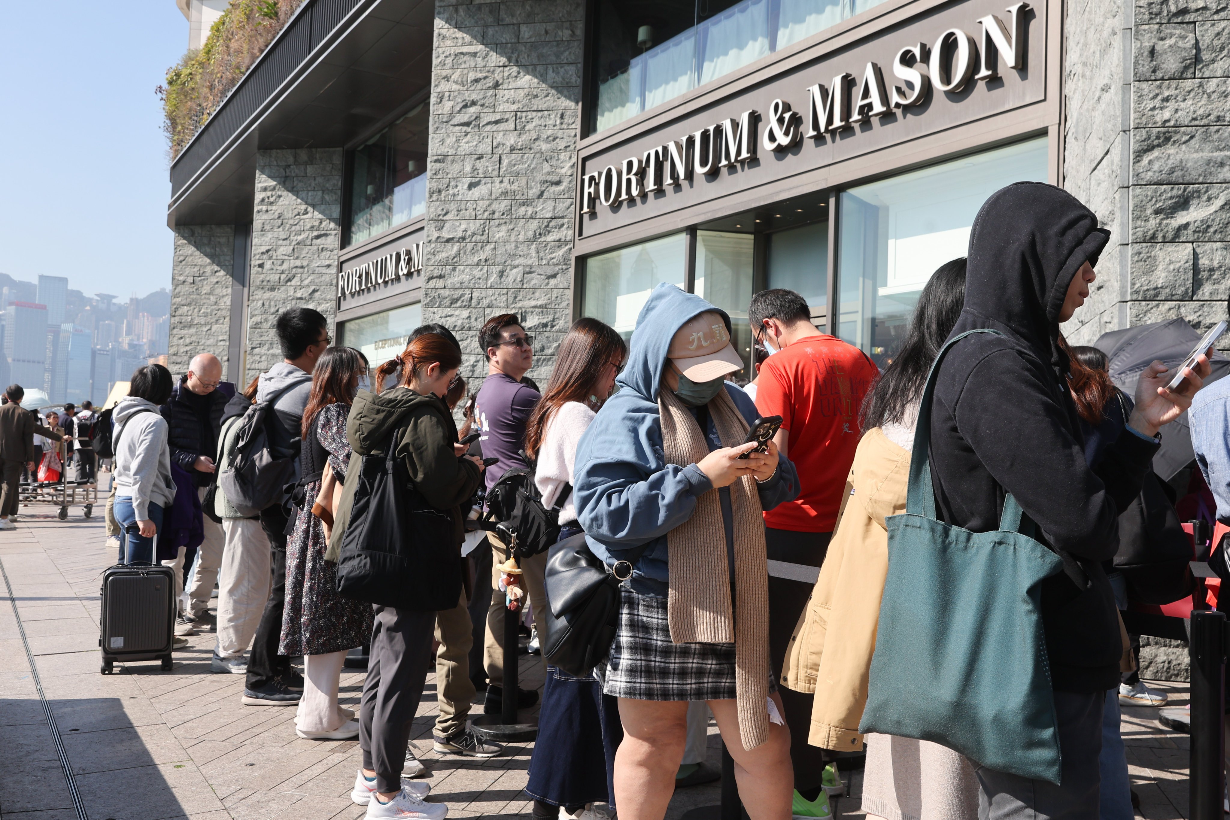 Hundreds of eager shoppers queue outside of Fortnum & Mason in Tsim Sha Tsui seeking bargains before the store closes on January 26.. Photo: Edmond So
