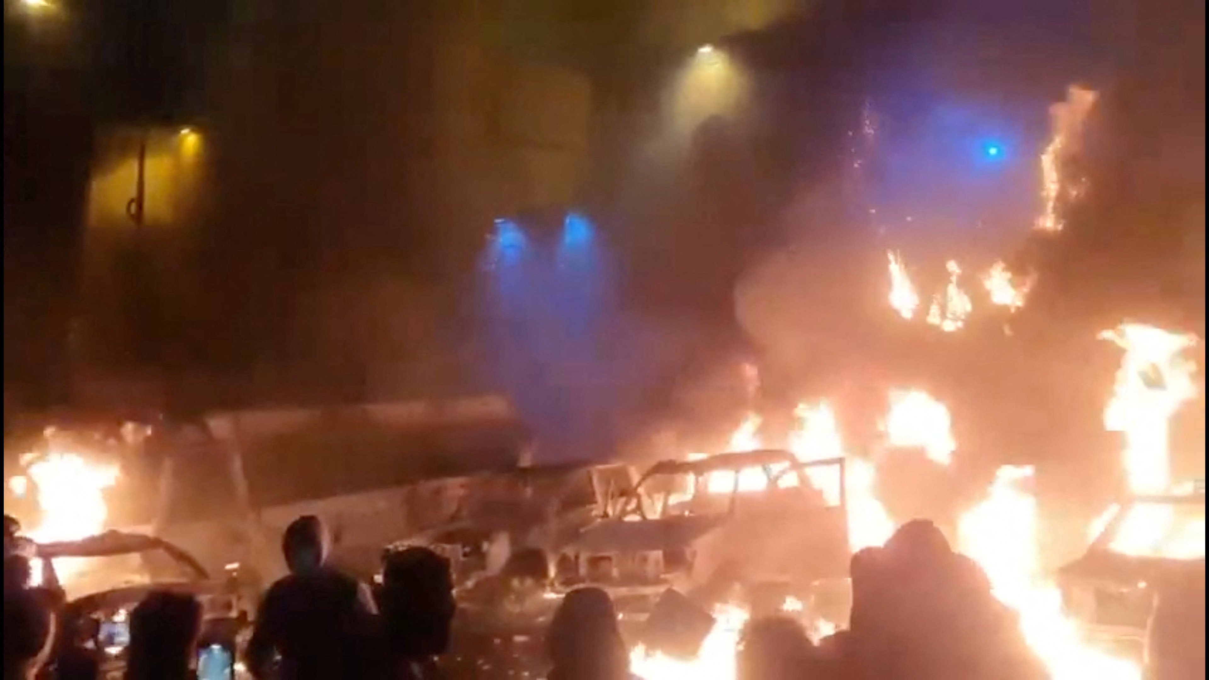 Protesters gather as vehicles burn, amid evolving anti-government unrest, in Tehran, Iran, in this screen grab obtained from a social media video released on Friday. Photo: Handout via Reuters