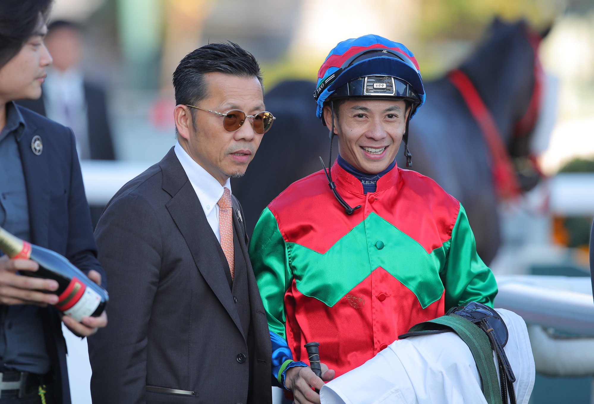 Trainer Frankie Lor and jockey Derek Leung after Money Catcher’s victory.