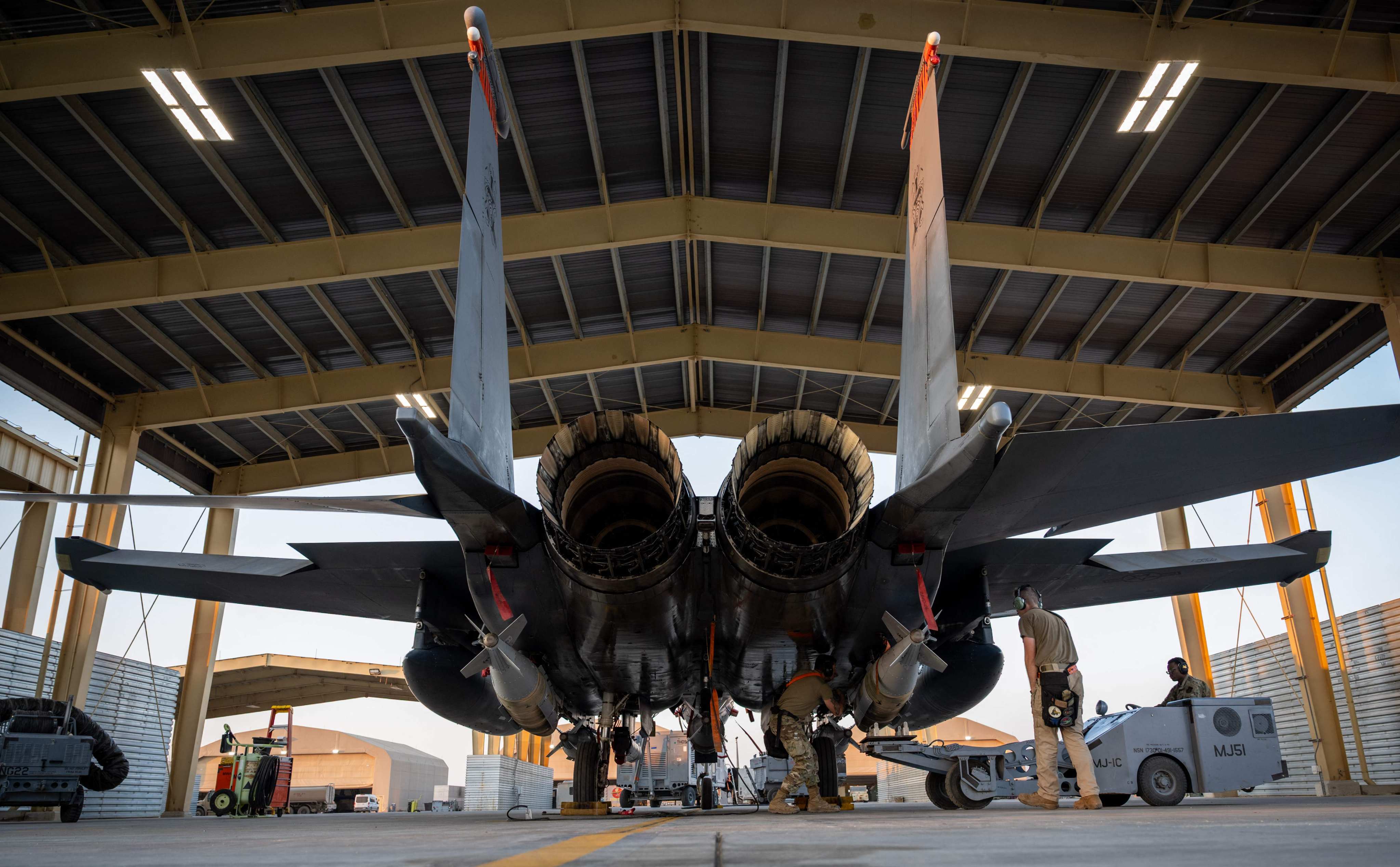US airmen load GBU-31 munition systems onto an F-15E Strike Eagle in support of Operation Hawkeye Strike in December. Photo: US Air Force via AFP