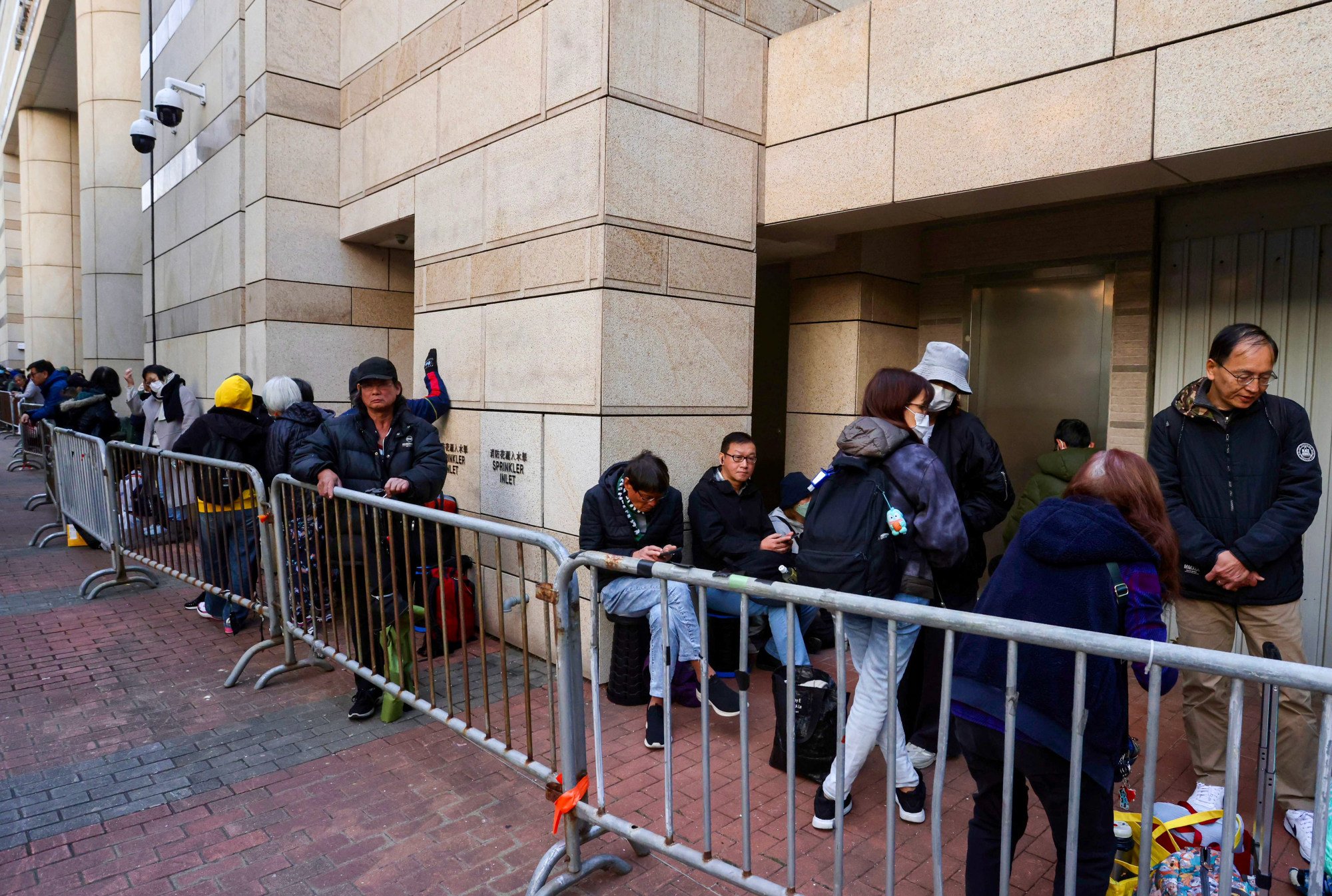People queue up outside West Kowloon Court. Photo: Jonathan Wong
