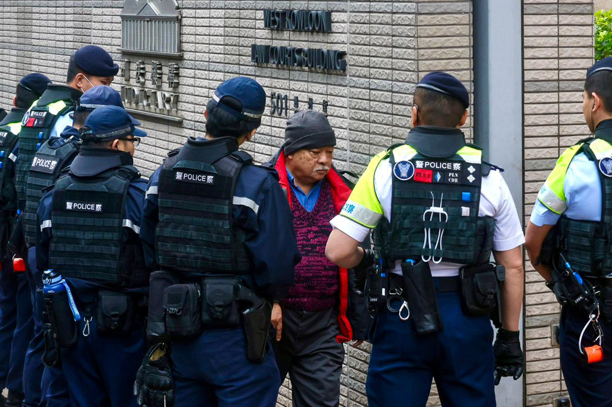 Police stop Tsang Kin-shing to search his bag. Photo: Jonathan Wong