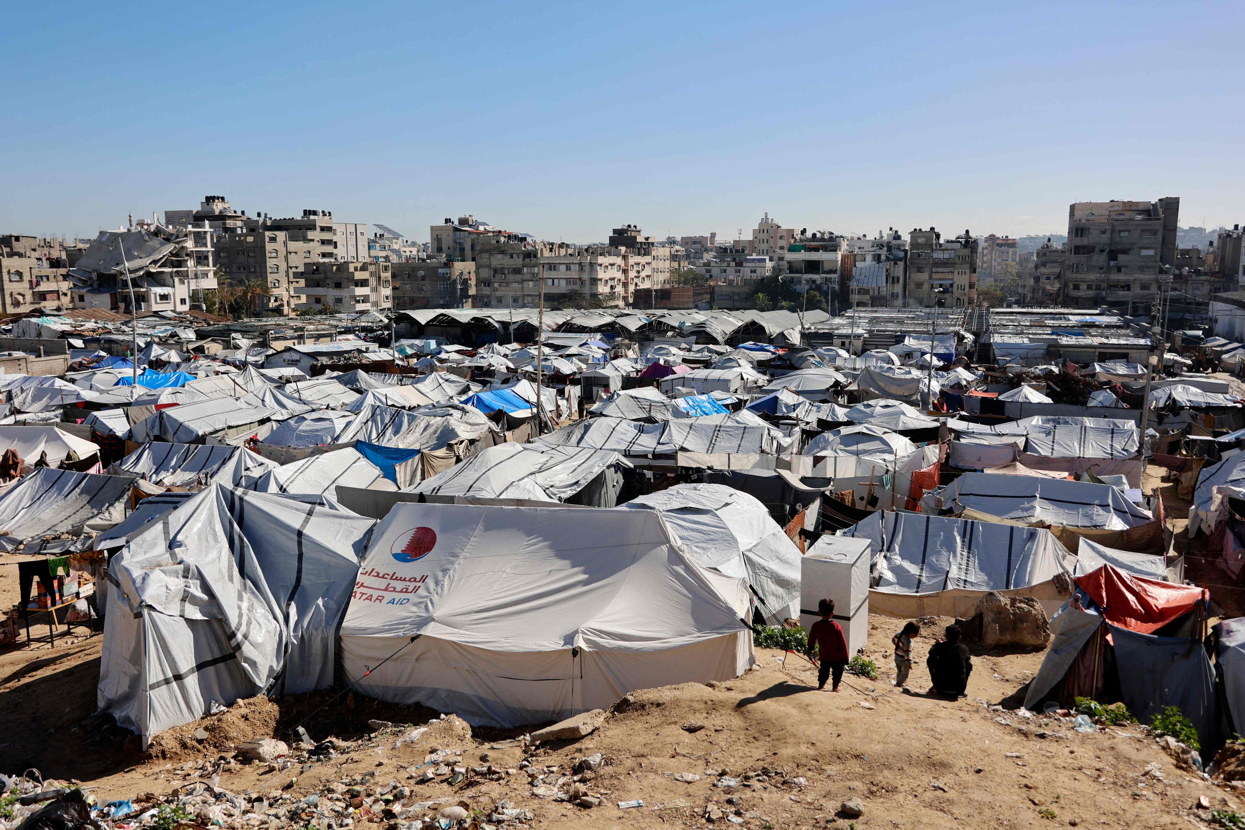 Tent shelters housing displaced Palestinian families are set up on empty land in Gaza City on Sunday. Photo: AFP