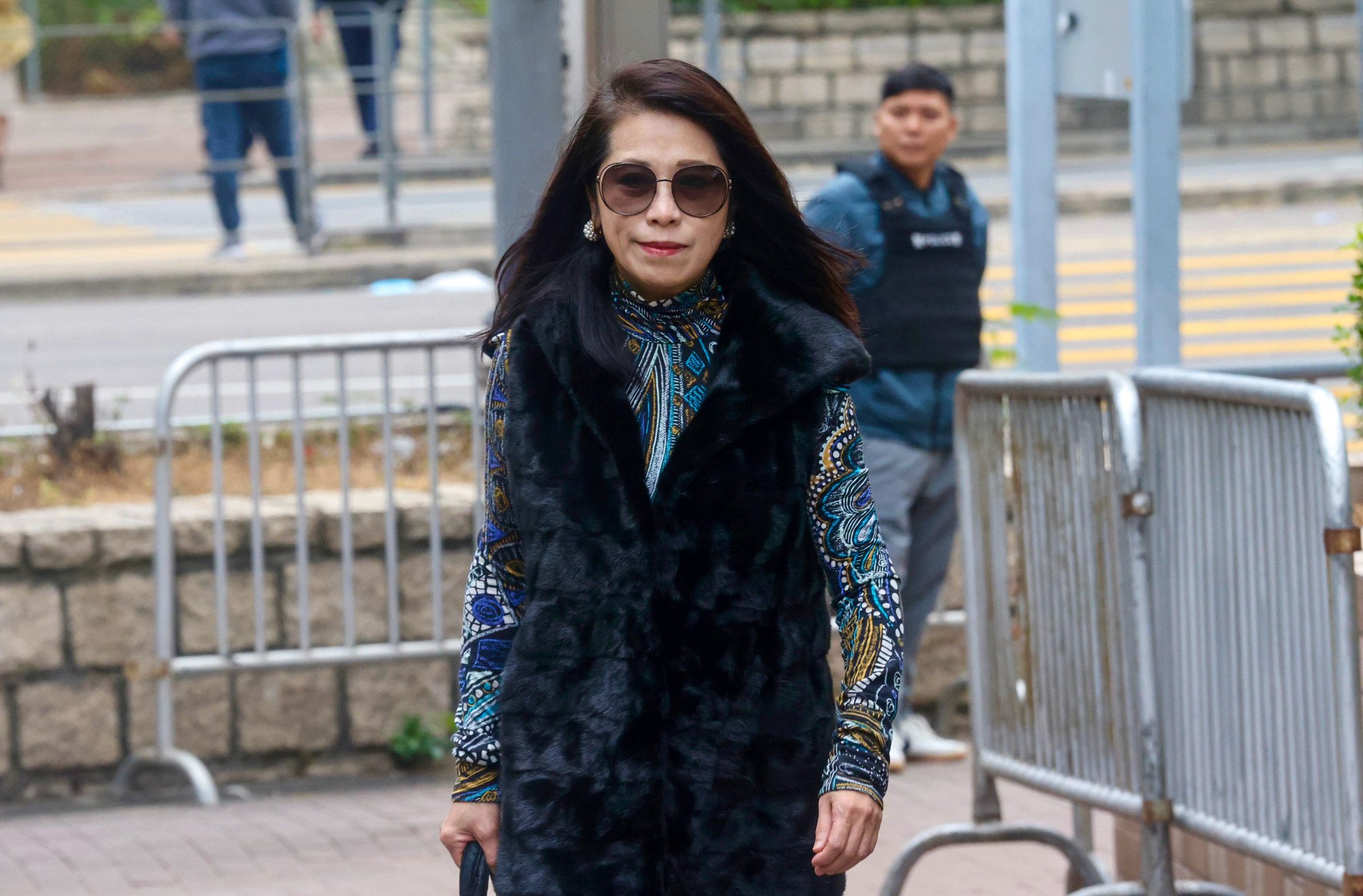 Lai’s wife, Teresa Li, waits to enter West Kowloon Court. Photo: Jonathan Wong