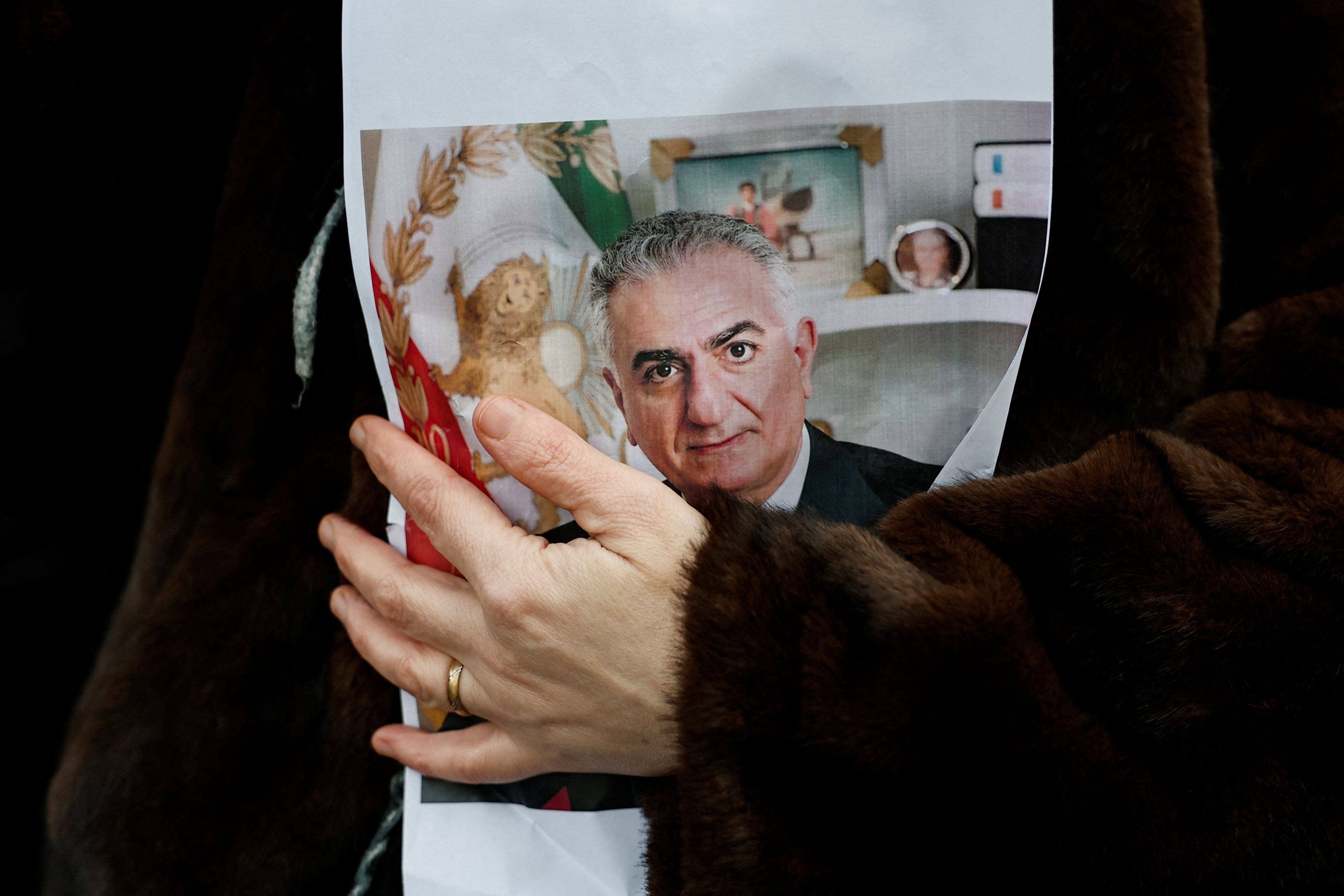A person holds a picture of Reza Pahlavi at protest in Paris, France, on January 11. Photo: Reuters