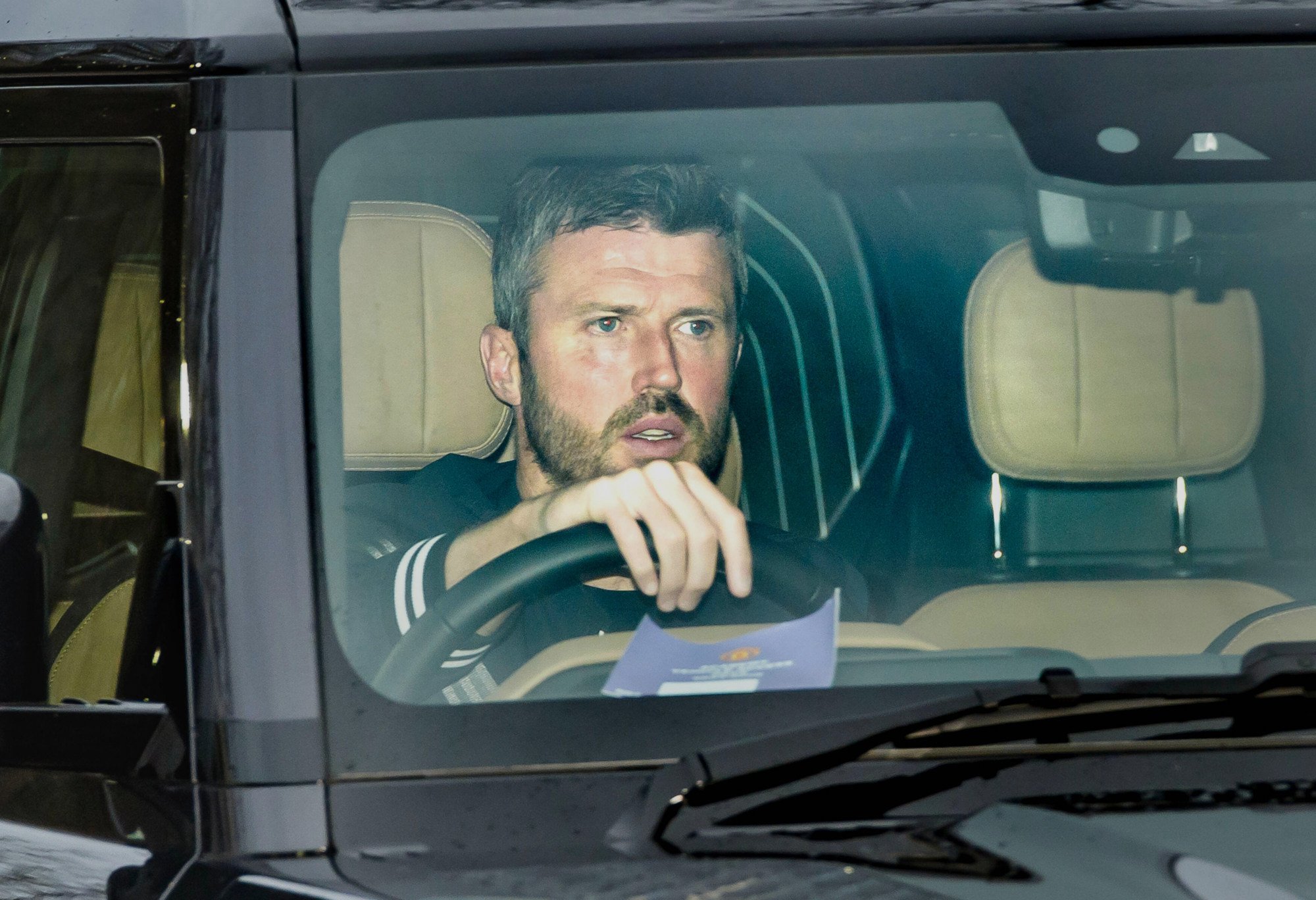 Michael Carrick arrives at Manchester United’s Trafford Training Centre in Carrington, England, on Tuesday. Photo: AP
