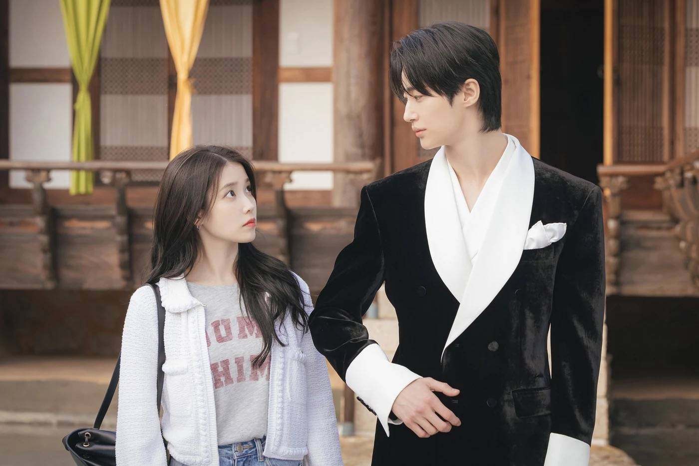 IU (left) and Byeon Woo-seok in a still from Perfect Crown.