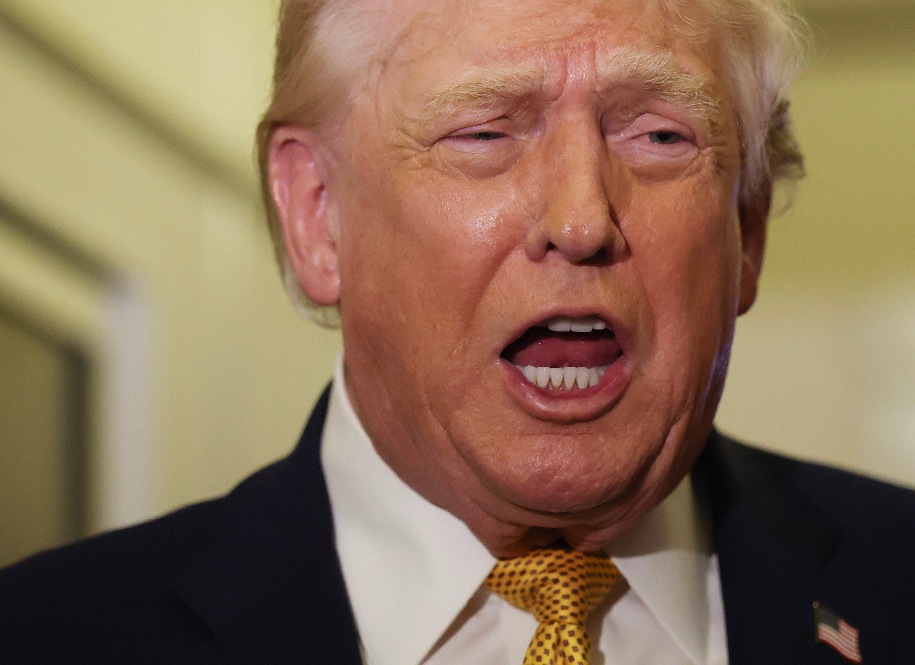 US President Donald Trump speaks to the media aboard Air Force One on January 4. Photo: TNS