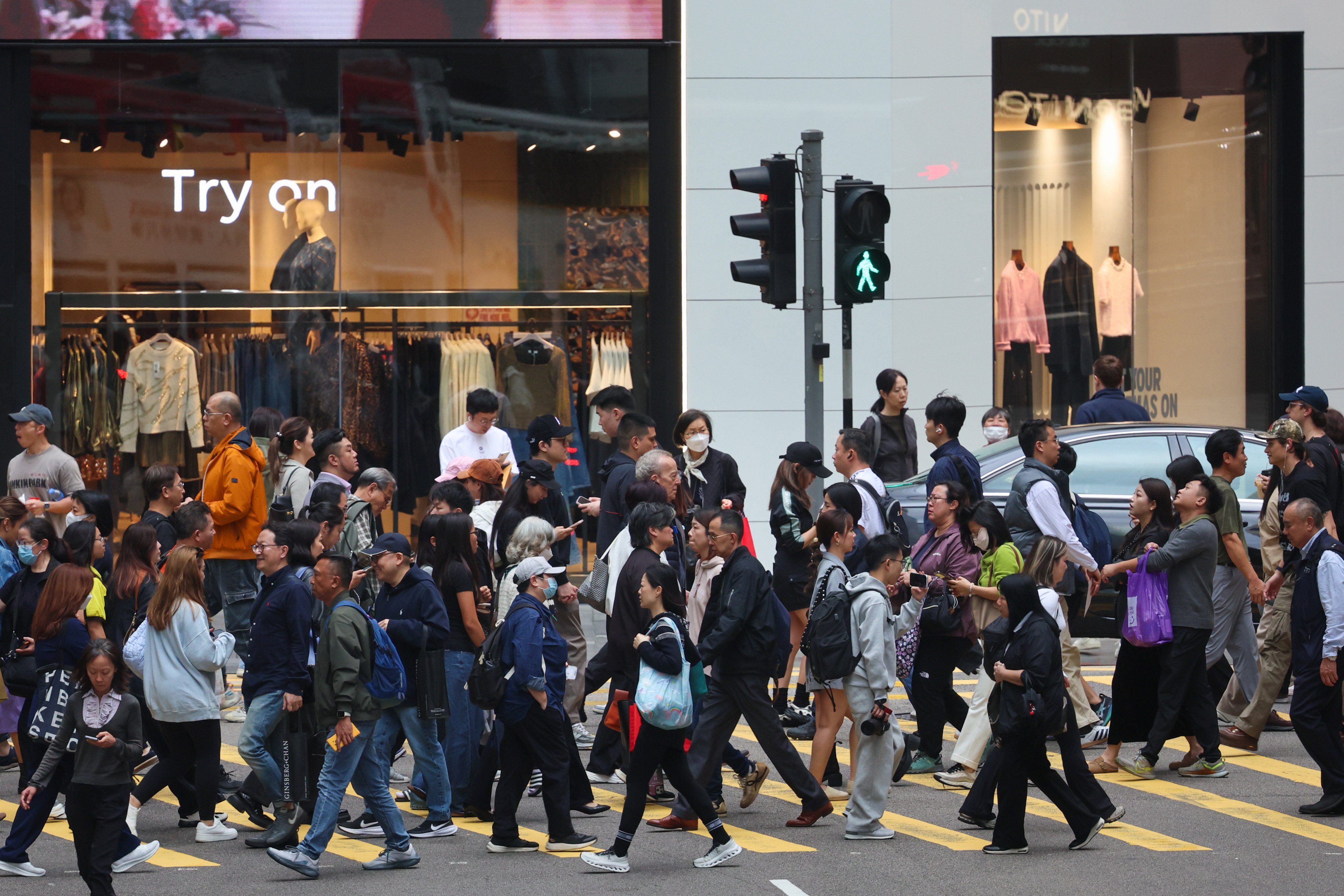 People crossing a street in Central on December 19, 2025. Scammers stole millions from Hongkongers in the first week of 2026. Photo: Dickson Lee