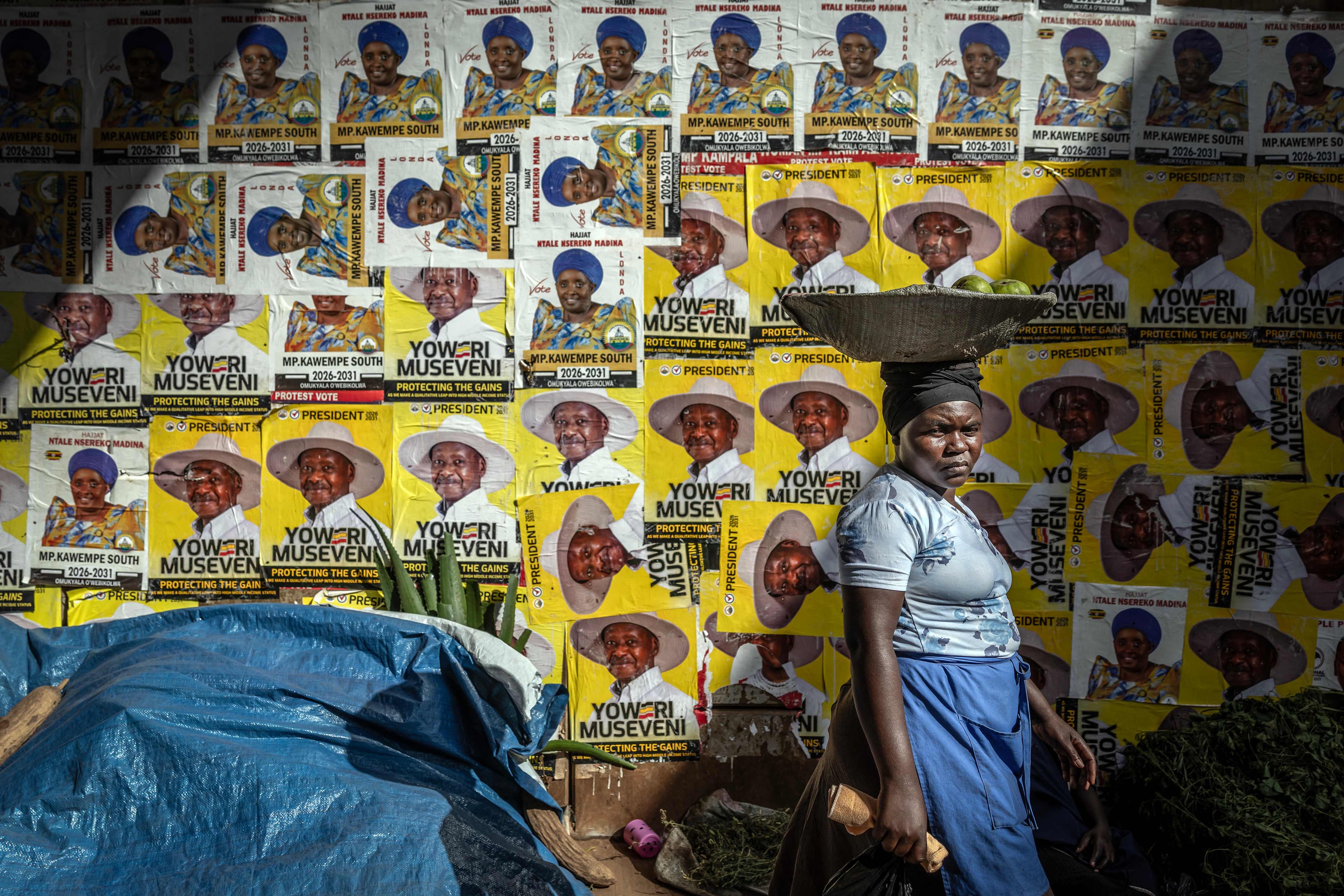 A wall decorated with posters supporting Uganda’s President Yoweri Museveni. Photo: AFP