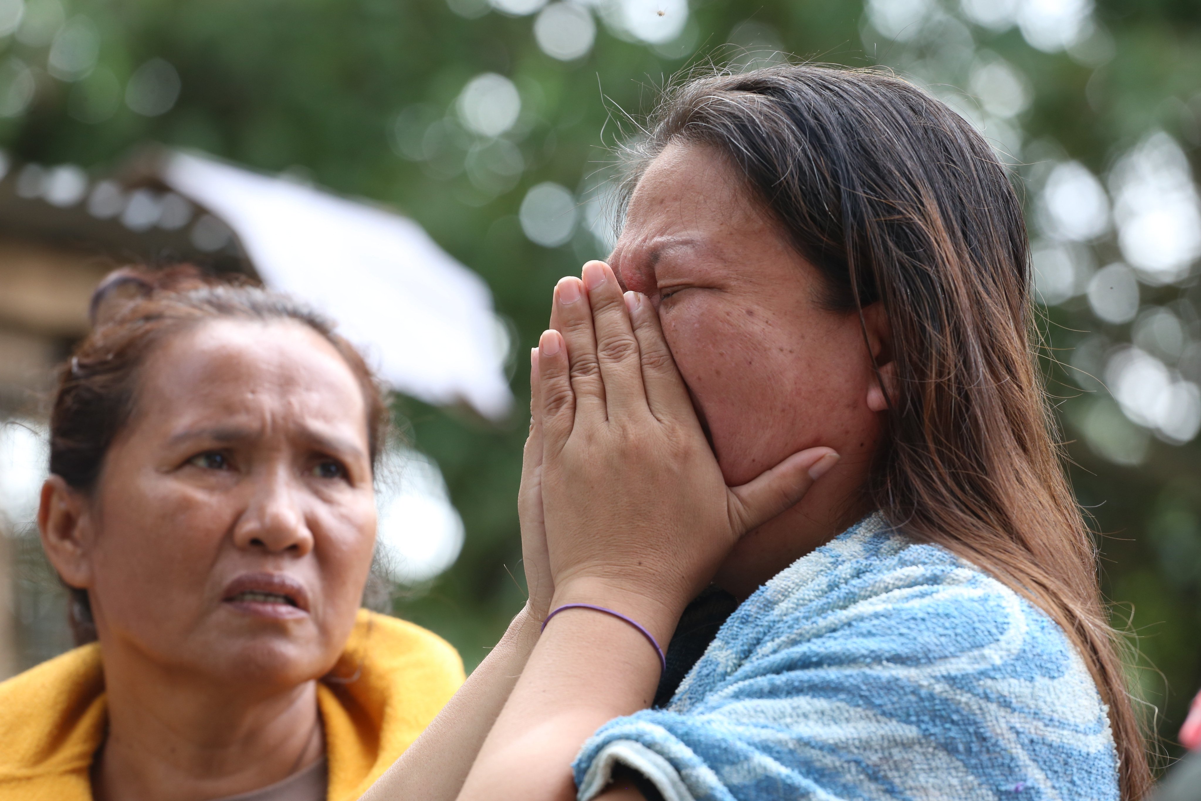Family members of missing workers react as rescue operations continue at a collapsed landfill in Binaliw, Cebu, Philippines, on January 11. Photo: AP