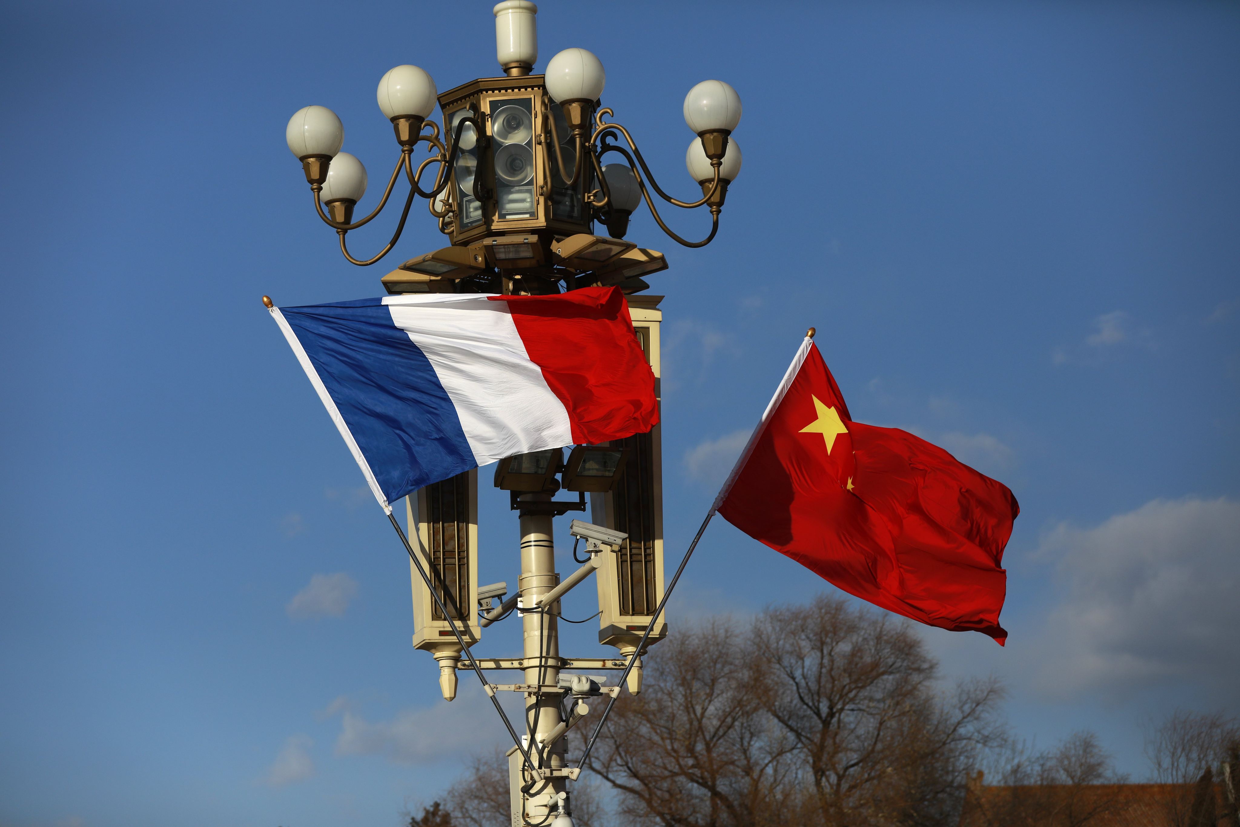 French and Chinese flags are flown in Beijing ahead of a welcome ceremony for French President Emmanuel Macron in January 2018. Photo: EPA-EFE