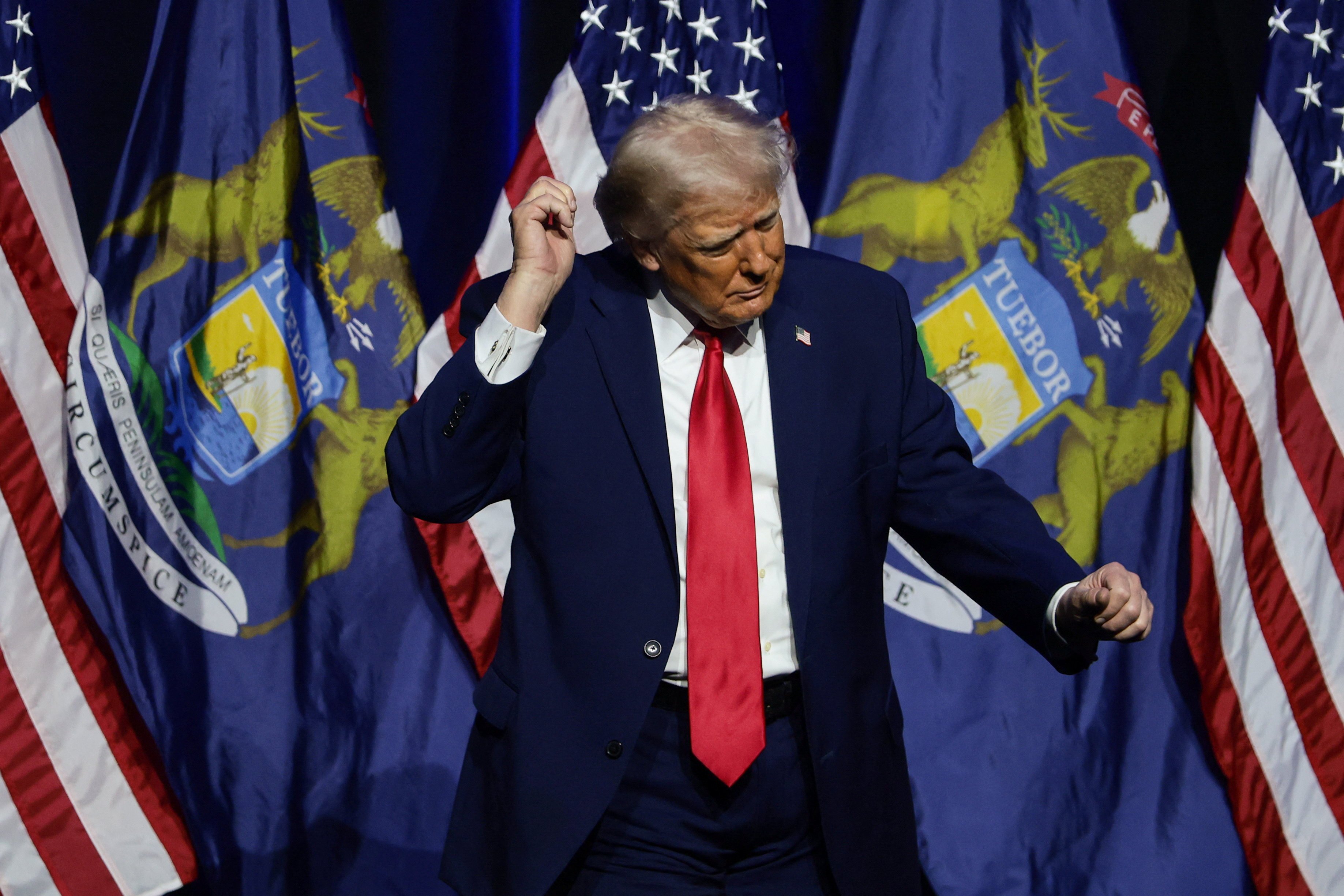 US President Donald Trump dances at the Detroit Economic Club in Detroit, Michigan, on January 13. Photo: Reuters