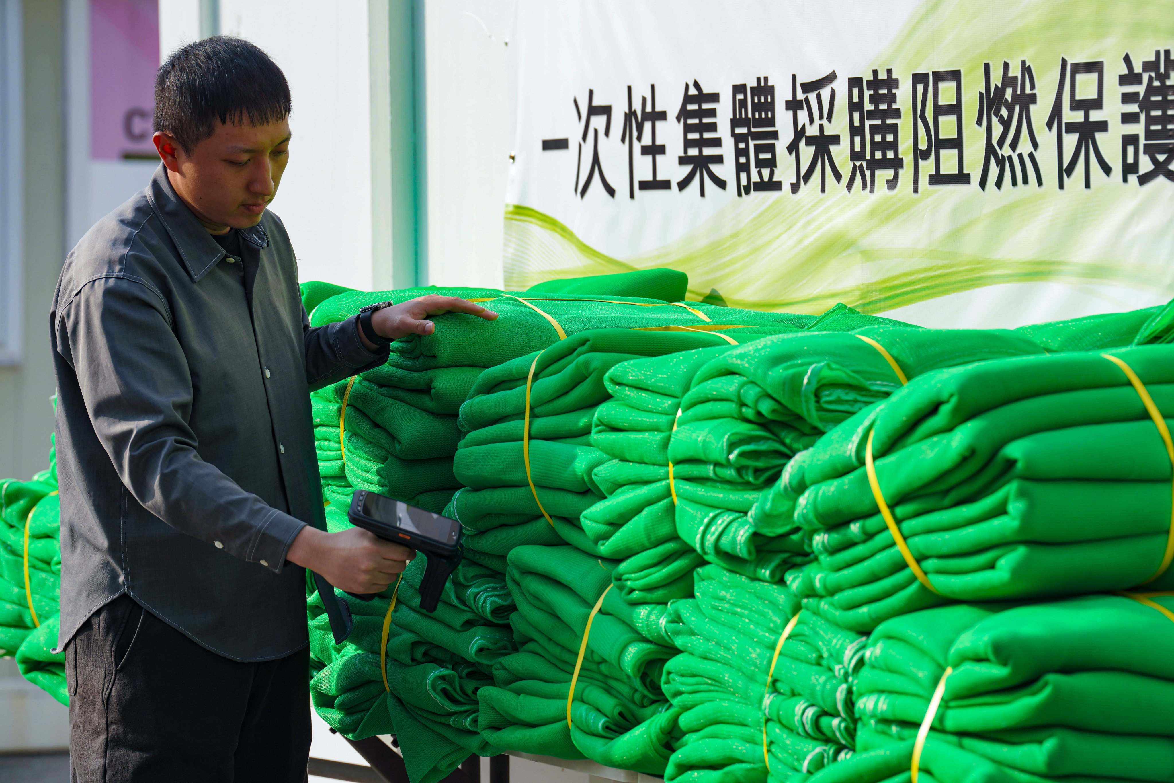 The first batch of fire-retardant safety nets at the warehouse in San Tin. Photo: Karma Lo