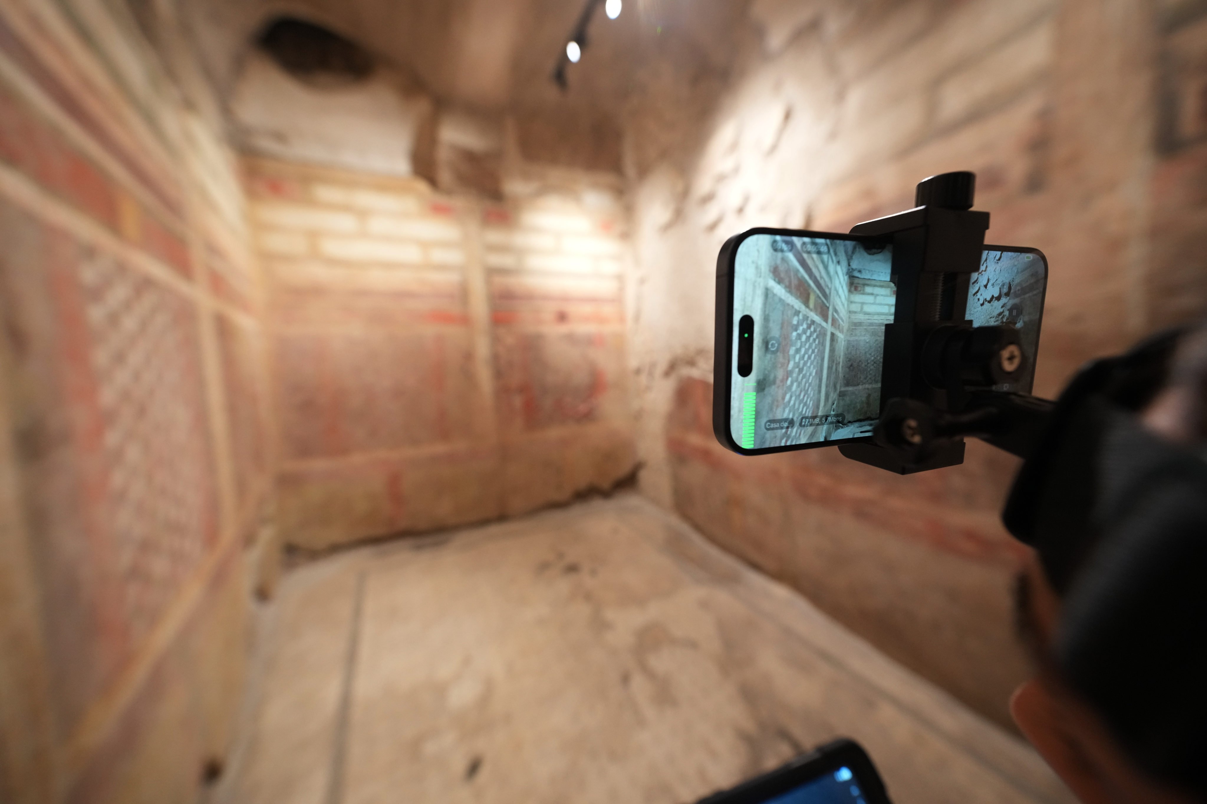 Colosseum Archeological Park guide Valentina uses a head-mounted device to livestream a guided tour of the newly restored underground House of the Griffins, dated between the second and first century BC, on the Palatine Hill next to the Colosseum, in Rome, Italy. Photo: AP