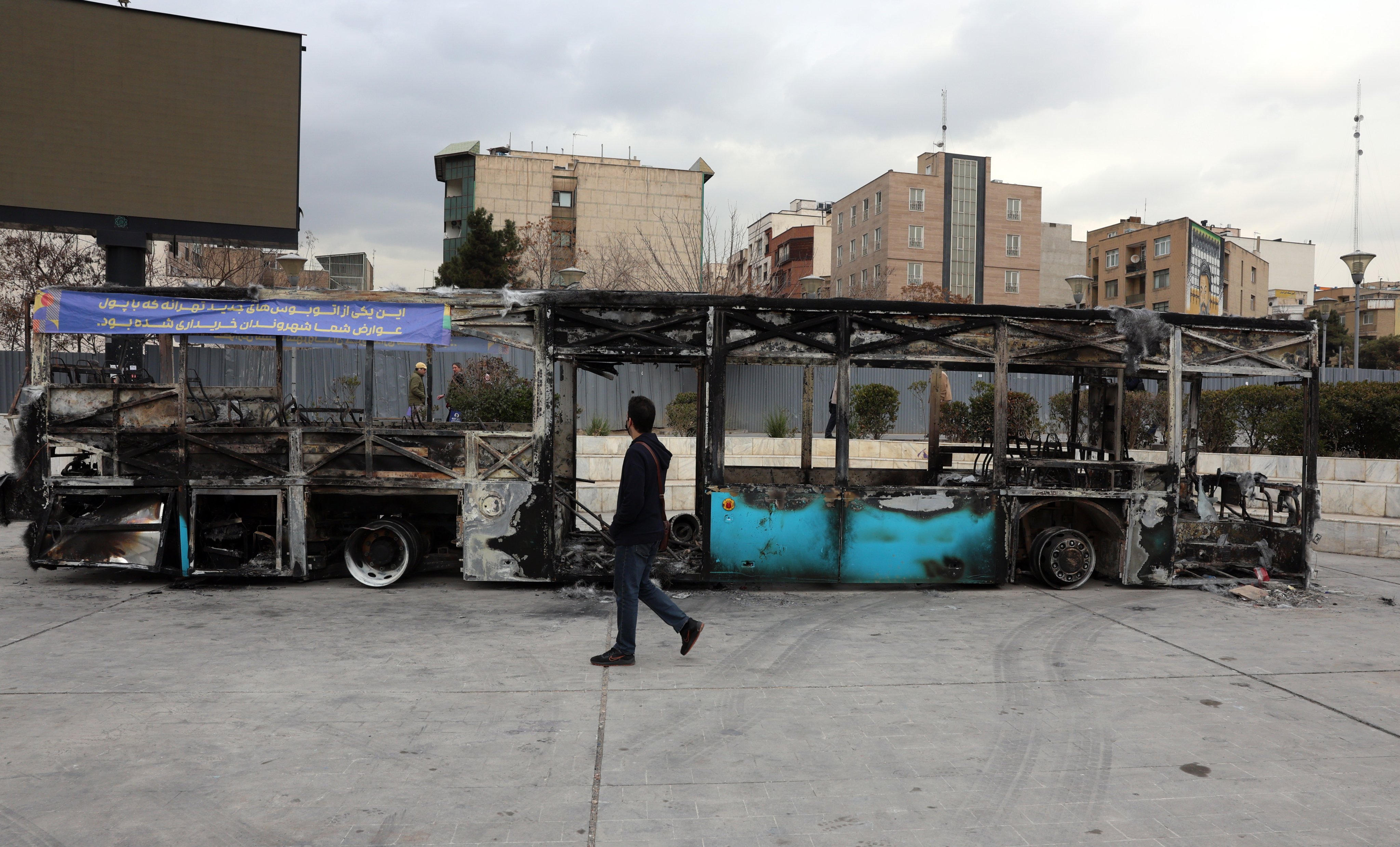 The wreckage of a burnt-out public bus in Tehran. Iran remains under a near-total nationwide internet blackout amid anti-government protests. Photo: EPA