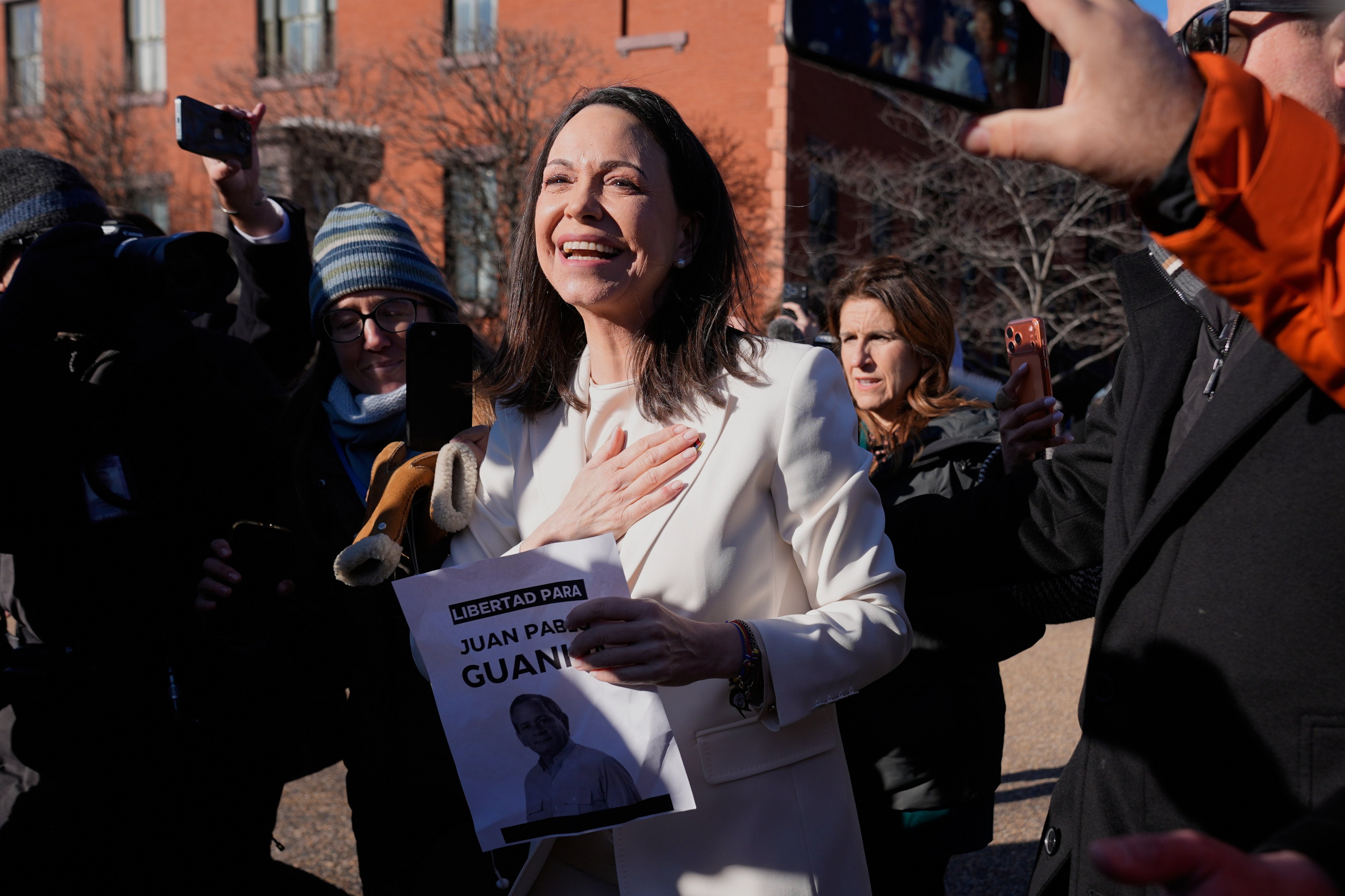 Venezuelan opposition leader Maria Corina Machado greets supporters on Pennsylvania Avenue near the White House after meeting with President Donald Trump. Photo: AP