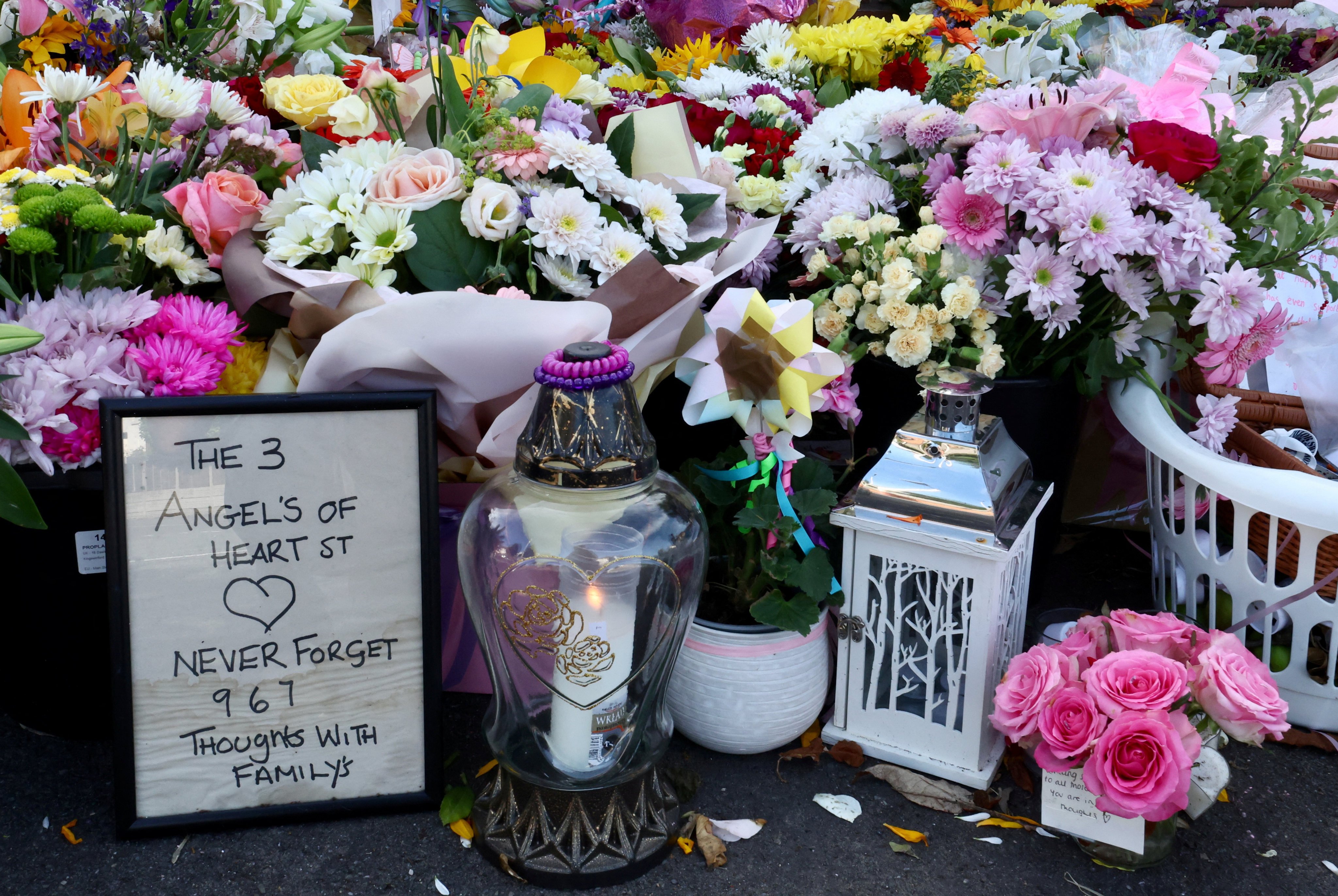 Flowers are seen at a makeshift memorial allowing people to pay their respects to the victims of a knife attack, in Southport, Britain on August 9, 2024. Photo: Reuters