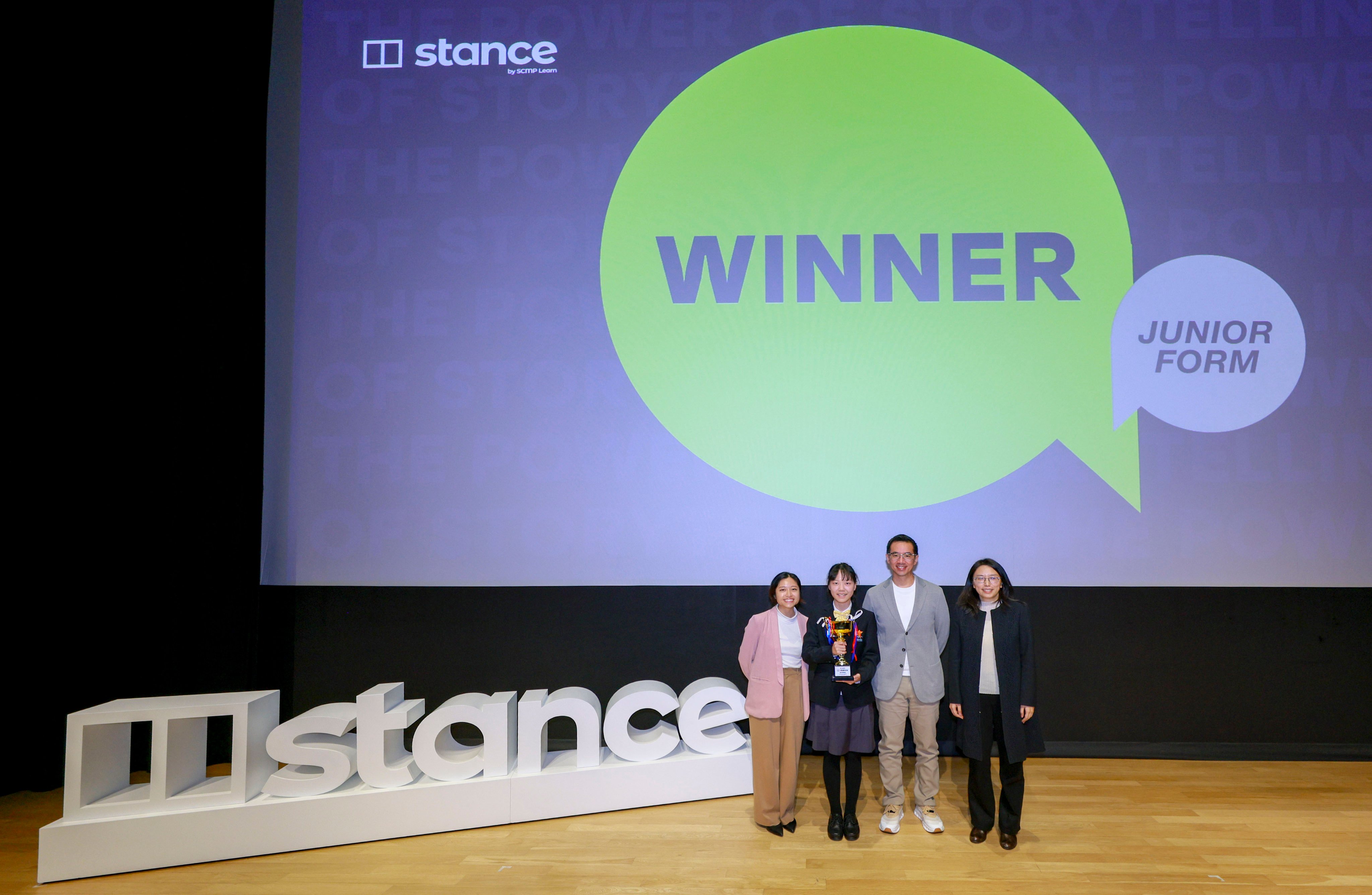 Wan Ruixi (second left) receives her award from judges Esther Cheung (left), deputy editor of SCMP’s Young Post, Spark and Posties, and Gary Lo, storytelling coach and managing director of Glo Consulting. They are joined by the Post’s Ang Jin (right). Photo: SCMP