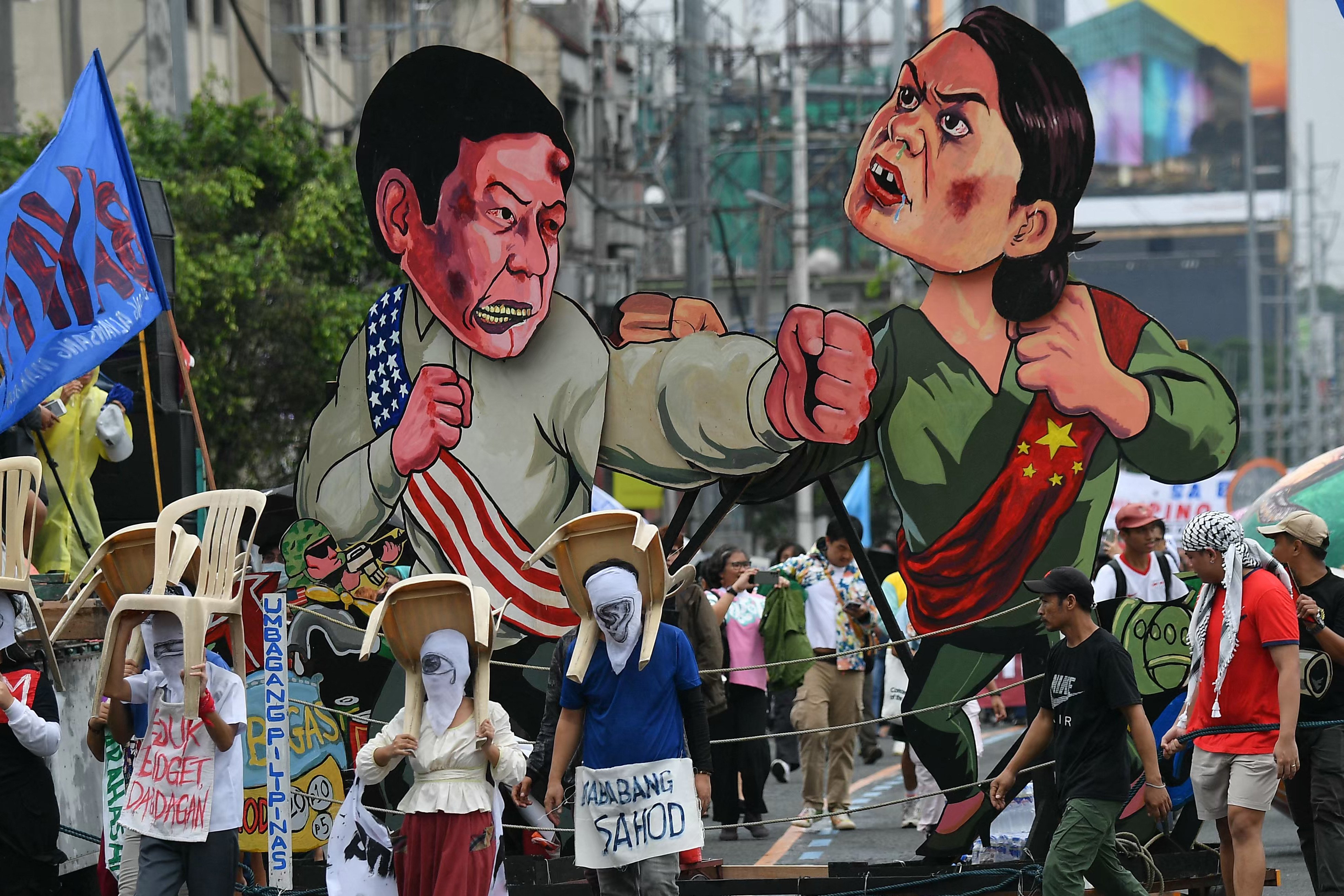 Effigies of Philippine President Ferdinand Marcos Jnr (left) and Vice-President Sara Duterte are seen at a protest march in Manila. Photo: AFP
