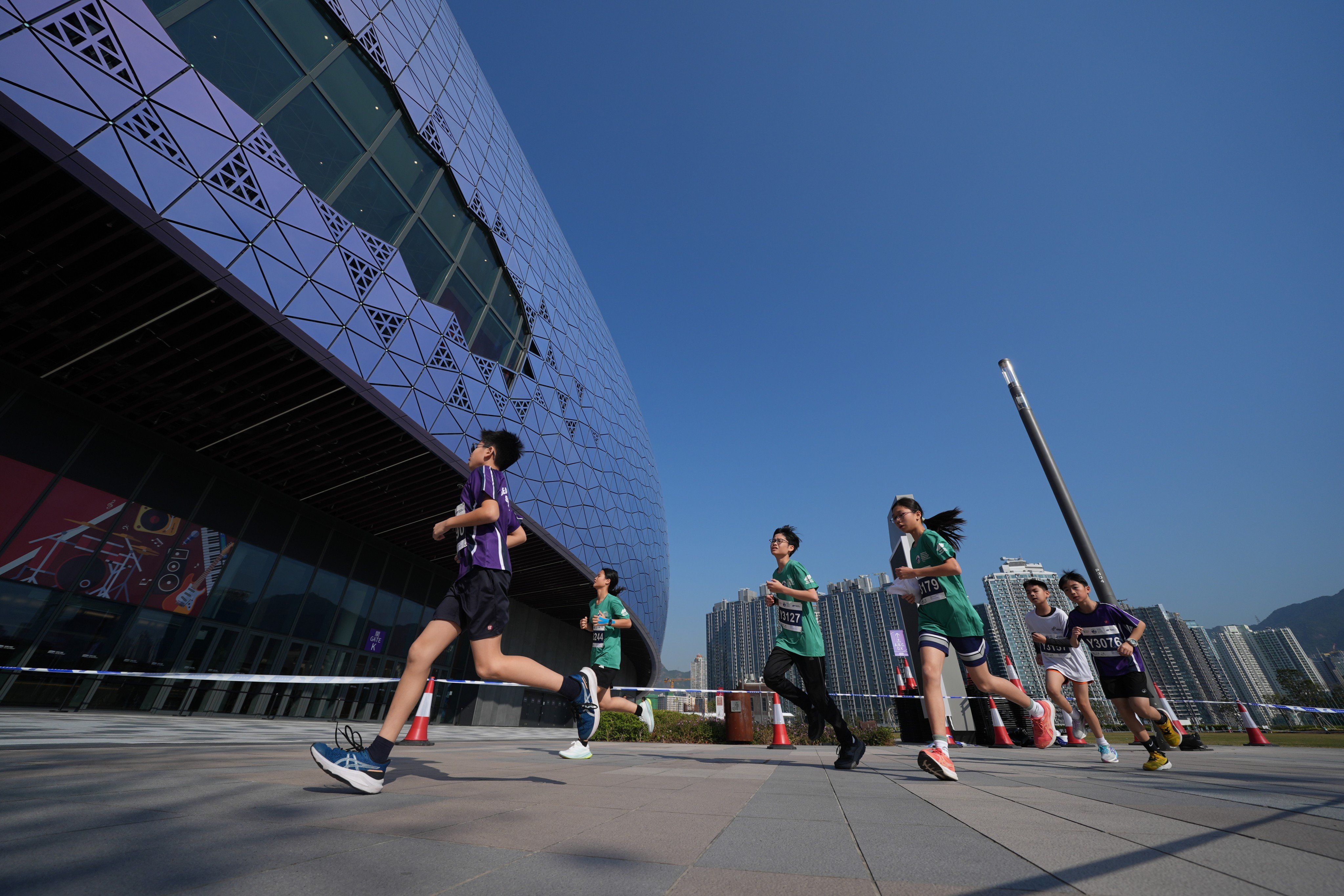 Youngsters participate in the Standard Chartered Hong Kong Marathon youth run held at Kai Tak Sports Park on January 17. Photo: Elson Li