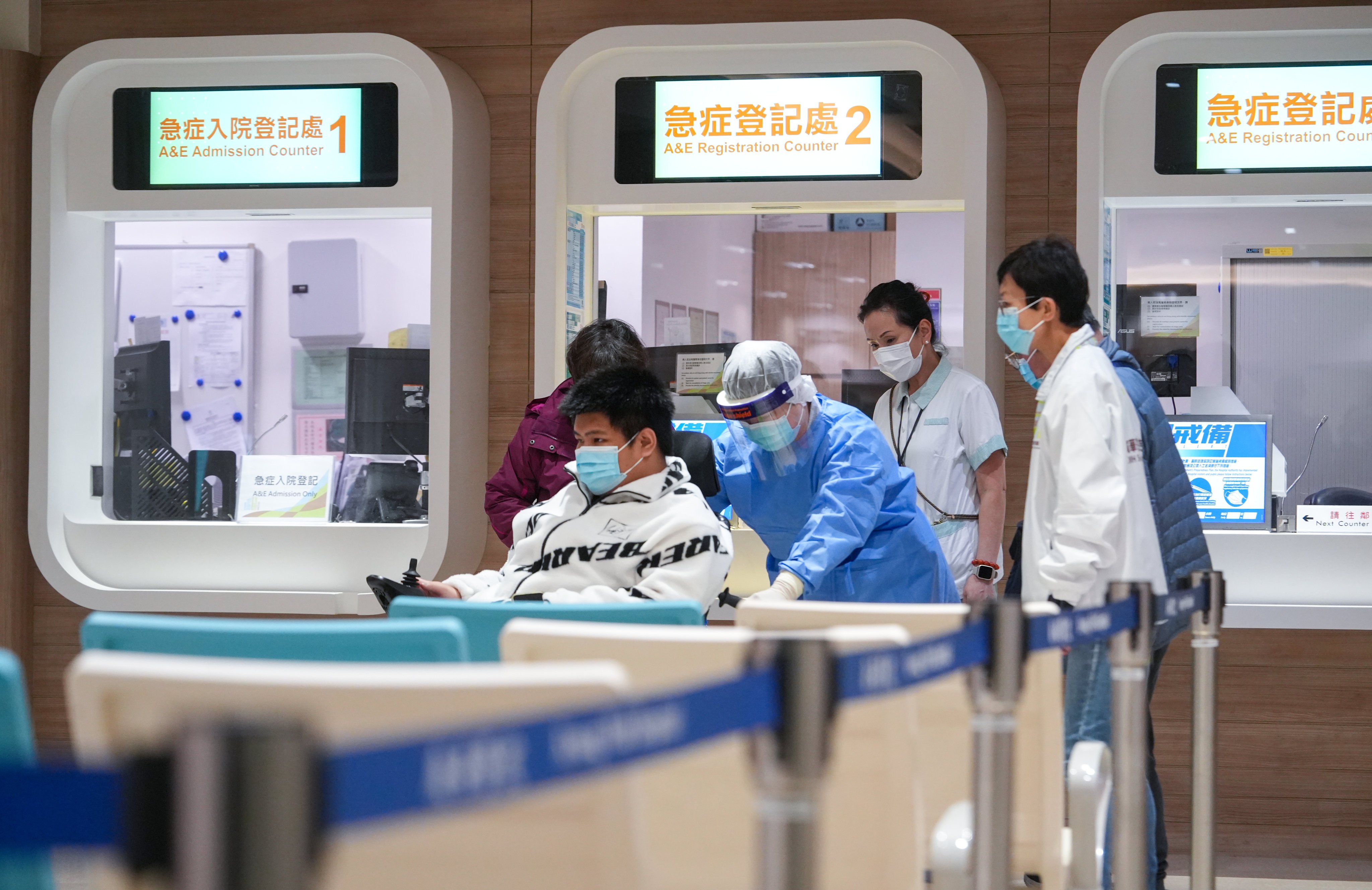 Hospital staff wheel a patient into Kwong Wah Hospital’s accident and emergency department. Photo: Sun Yeung