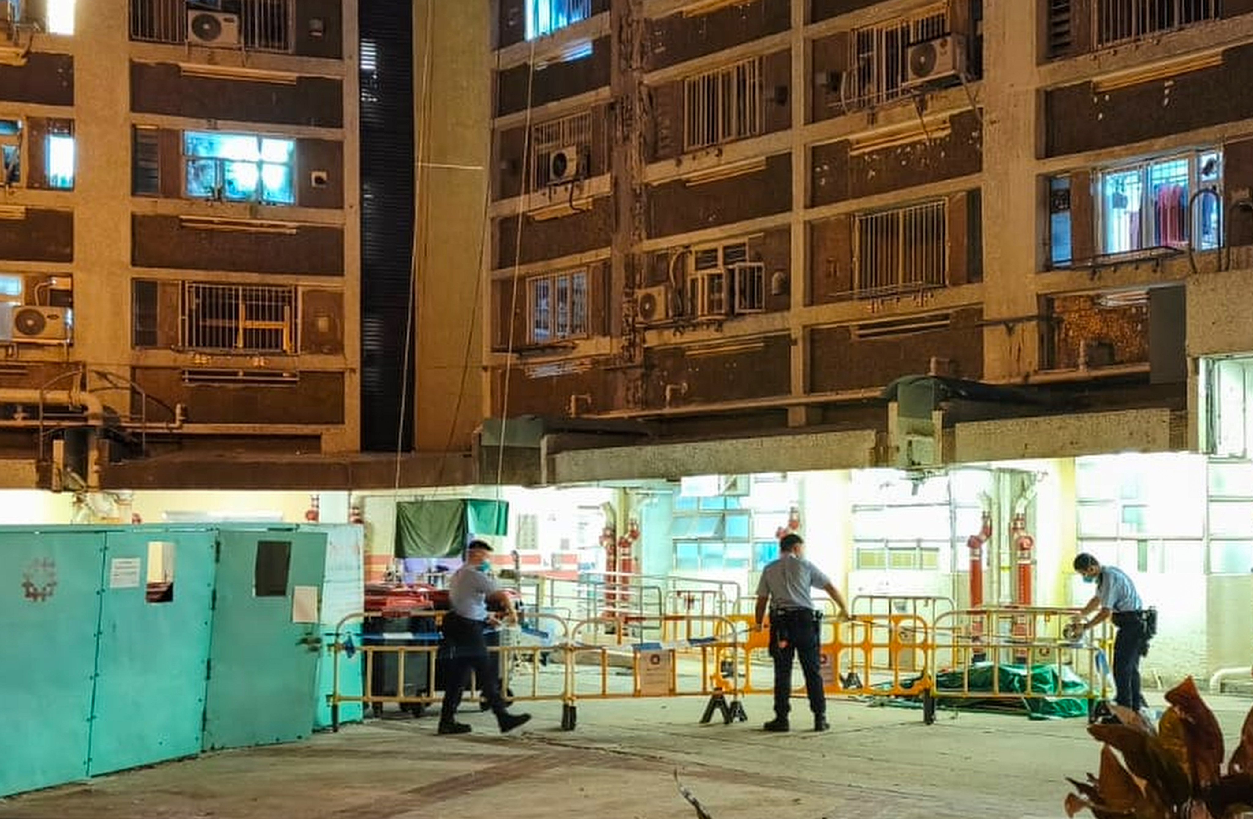 Police officers carry out investigations at Lok Wah South Estate last month following the murder case coming to light. Photo: handout
